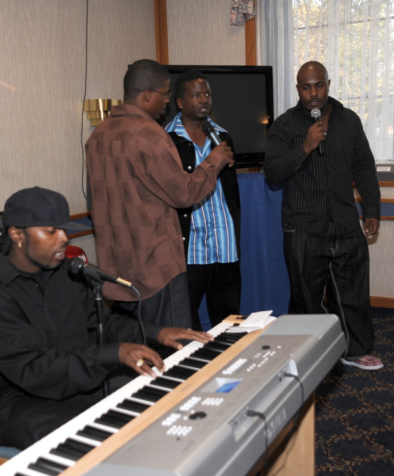 CANNON AIR FORCE BASE N.M.-- At the Quarterly Birthday Meal Oct. 23, Voices of Harmony entertained guests all night long at the Pecos Trail Dining Facility. The singing group consisted of civilian and Air Force members. (U.S. Air Force photo by Airman Maynelinne De La Cruz)