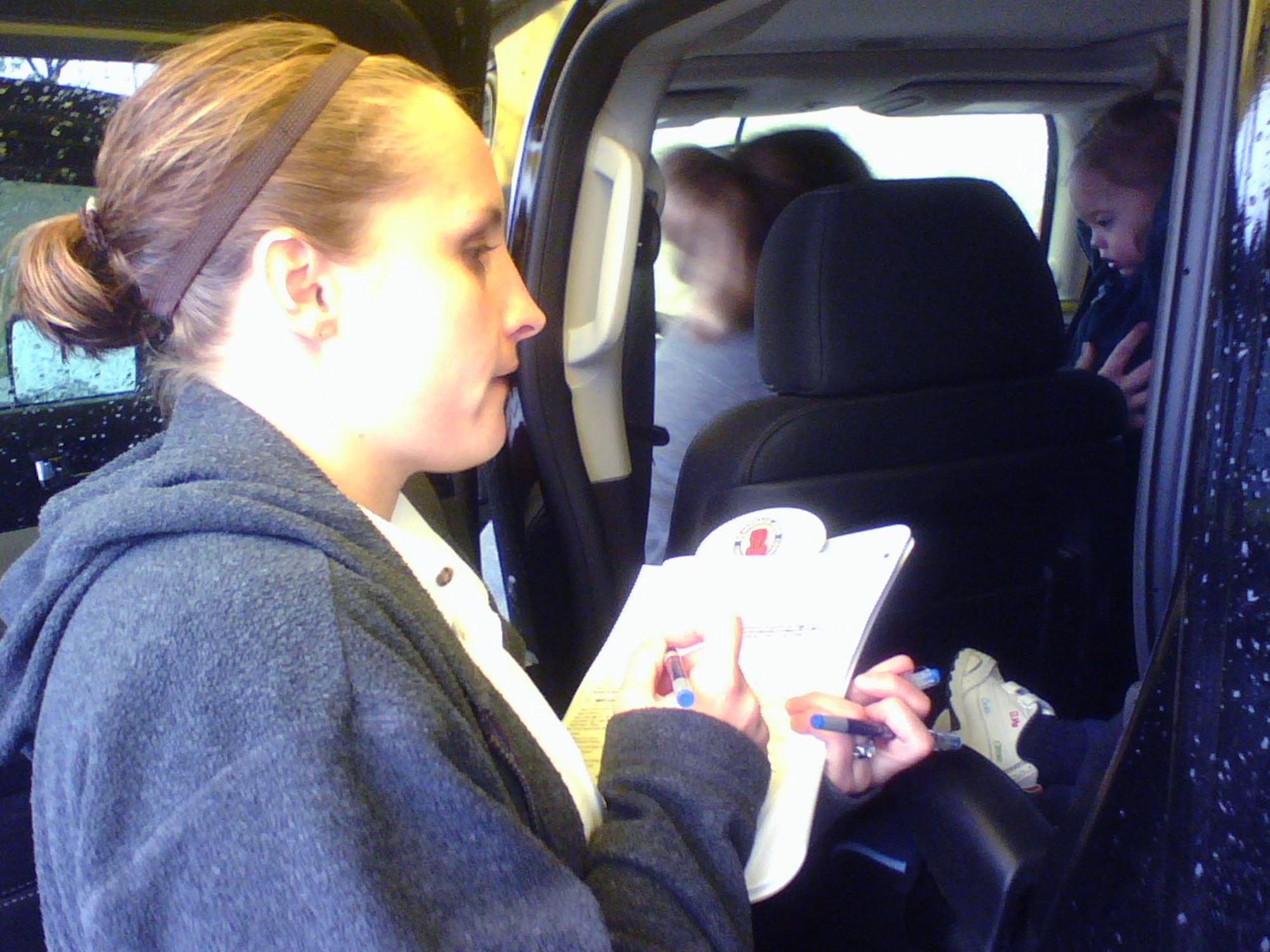 Child safety seat technician Sheri Wilson, from the Fairborn, Ohio Fire Department, inspects the vehicle of a Wright-Patterson Air Force Base Airman to ensure proper child seat installation. More than 70 base-affiliated families signed up to receive the free safety checks at Wright-Patt's North Child Development Center Oct. 24. Technicians identified installation errors in more than 80 percent of vehicles, including instances of recalled or defective child safety seats in nearly one out of every four vehicles inspected.  Recalled seats were replaced free of charge by event sponsor, Chrysler.  Inspectors said the results are not uncommon and encourage others to visit seatcheck.org for more information.  (U.S. Air Force photo/Derek Kaufman)