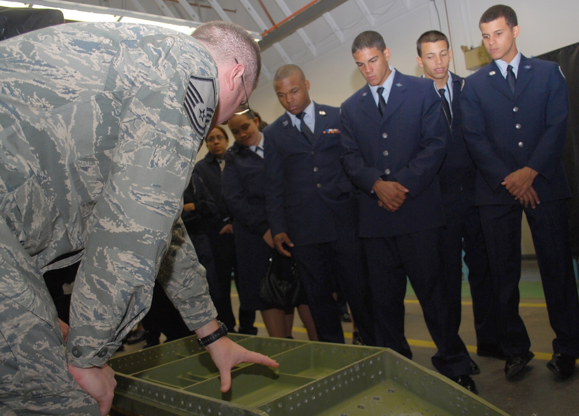 Master Sgt. Robert Richter, 439th Maintenance Squadron, explains a T-tail box of a C-5 Galaxy to members of the Dean Junior ROTC Detachment during a base tour at Westover Oct. 22. The cadets toured a sheet metals shop, a C-5, and the base fire station during their visit to the base from Holyoke, Mass. (US Air Force photo/Tech. Sgt. Andrew Biscoe)