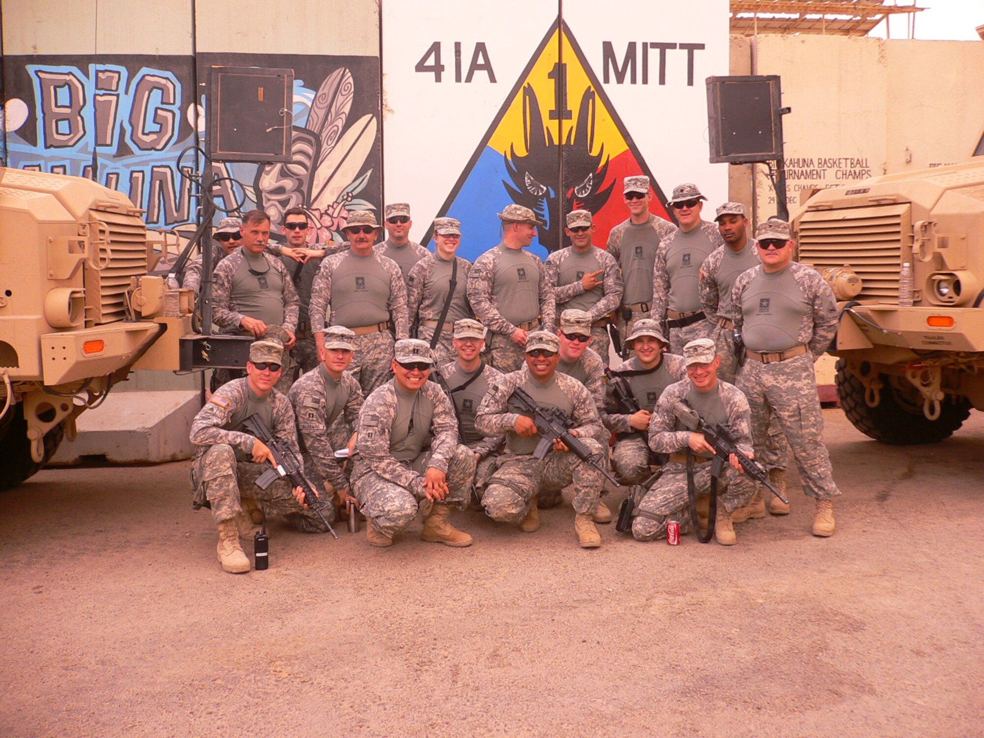 Soldiers in Iraq pose in the shirts sent to them by Christmas For Our Troops (Courtesy Photo)