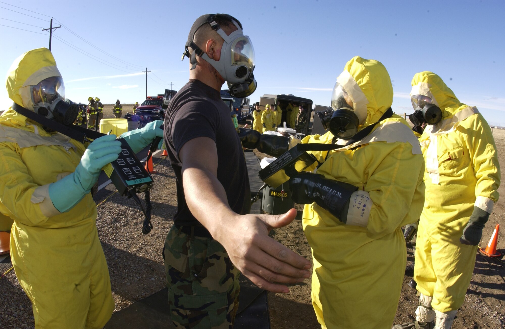 An Airman goes through decontamination procedures during an exercise scenario carried out during the last Nuclear Surety Inspection in January 2006. (U.S. Air Force photo)     