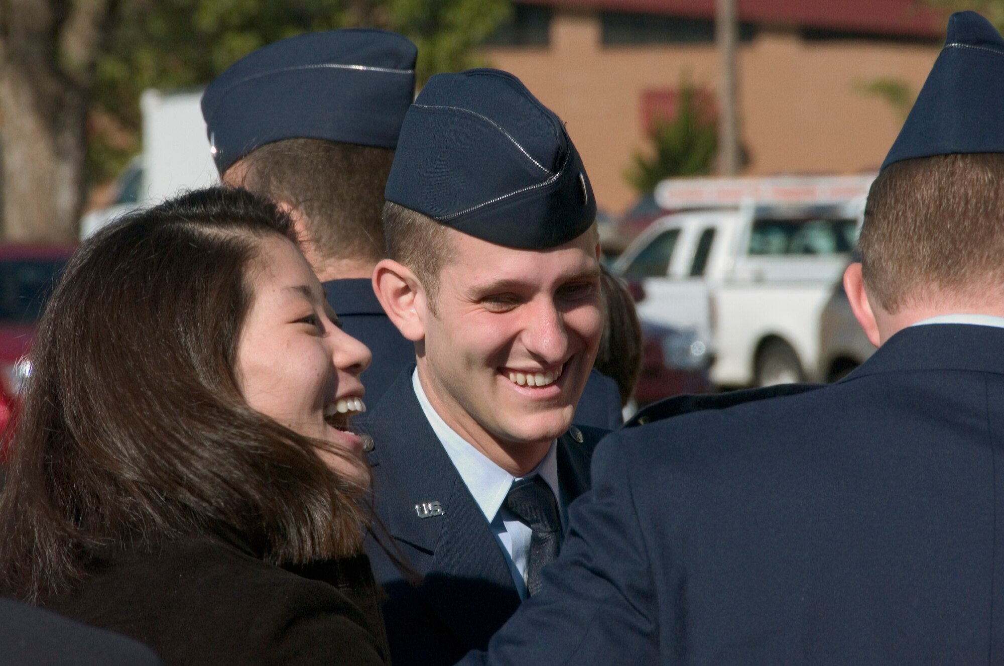 First Lt. James Shepard and his girl friend, Ashley Han, celebrate with friends and family after receiving his pilot wings during the Class 09-01 graduation ceremony Friday, Oct. 24, here. Lieutenant Shepard will fly KC-10s at Travis AFB, Calif. Gen. Stephen Lorenz, the commander of Air Education and Training Command spoke at Class 09-01’s graduation. (U.S. Air Force photo by Staff Sgt. Brian Hill)