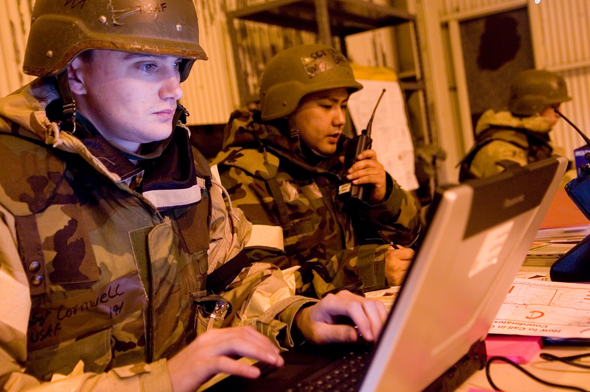 Staff Sgt. Sean Cornwell, left, and Staff Sgt. Casper Garcia, 62nd Logistics Readiness Squadron, coordinate fuel operations for the MOBEX. (U.S. Air Force photo/Abner Guzman)
