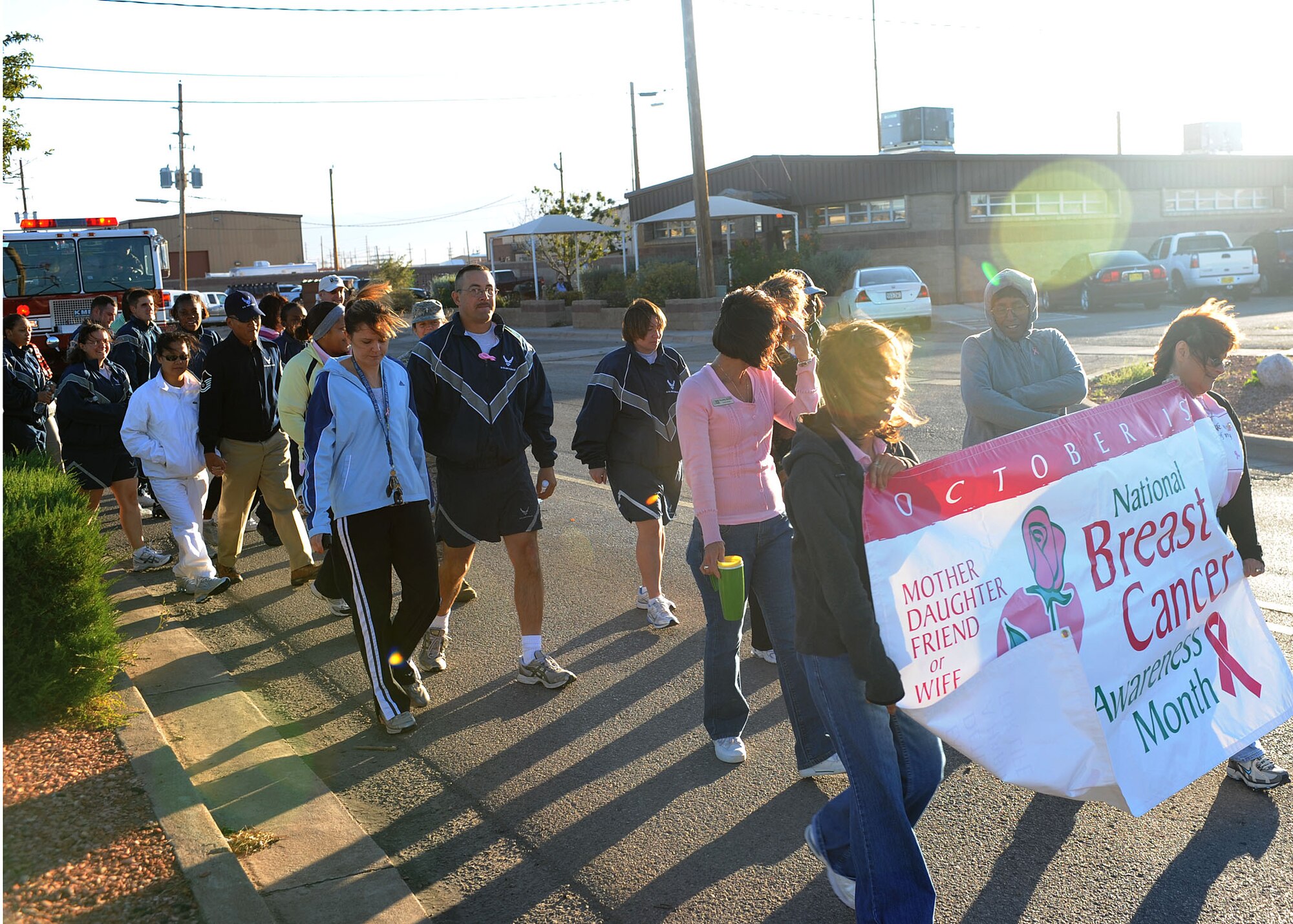 Participants in the Walk Against Breast Cancer began walking in front of the base housing office at Holloman Air Force Base, N.M., October 22. The walk was a mile in length to support National Breast Cancer Awareness Month. (U.S Air Force photo/ Airman 1st Class DeAndre Curtiss)