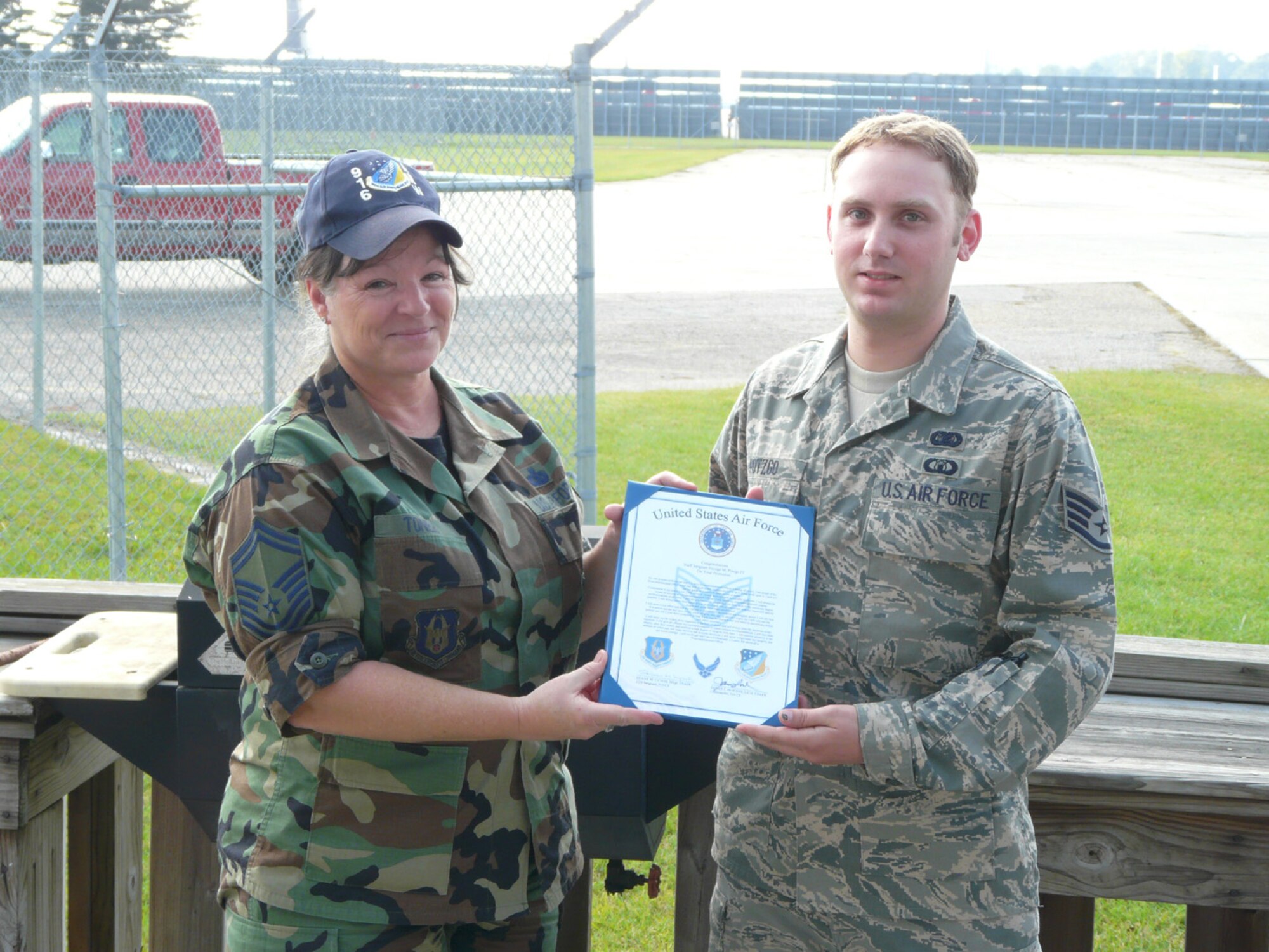SEYMOUR JOHNSON AIR FORCE BASE, N.C. -- Senior Master Sgt. Judy Toner congratulates Staff Sgt. George M. Potzgo IV on his promotion. Sergeant Potzgo achieved the rank of staff sergeant on Sept. 1, 2008. Sergeant Potzgo is an information management journeyman who plays a critical role in managing the affairs of 916th Communication Squadron and its personnel.