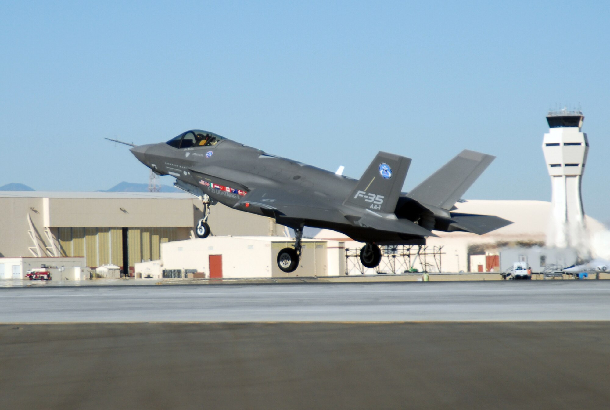 An F-35 Joint Strike Fighter, marked AA-1, lands Oct. 23 at Edwards Air Force Base, Calif. The F-35 Integrated Test Force staff concluded an air-start test. (U.S. Air Force photo/Senior Airman Julius Delos Reyes)