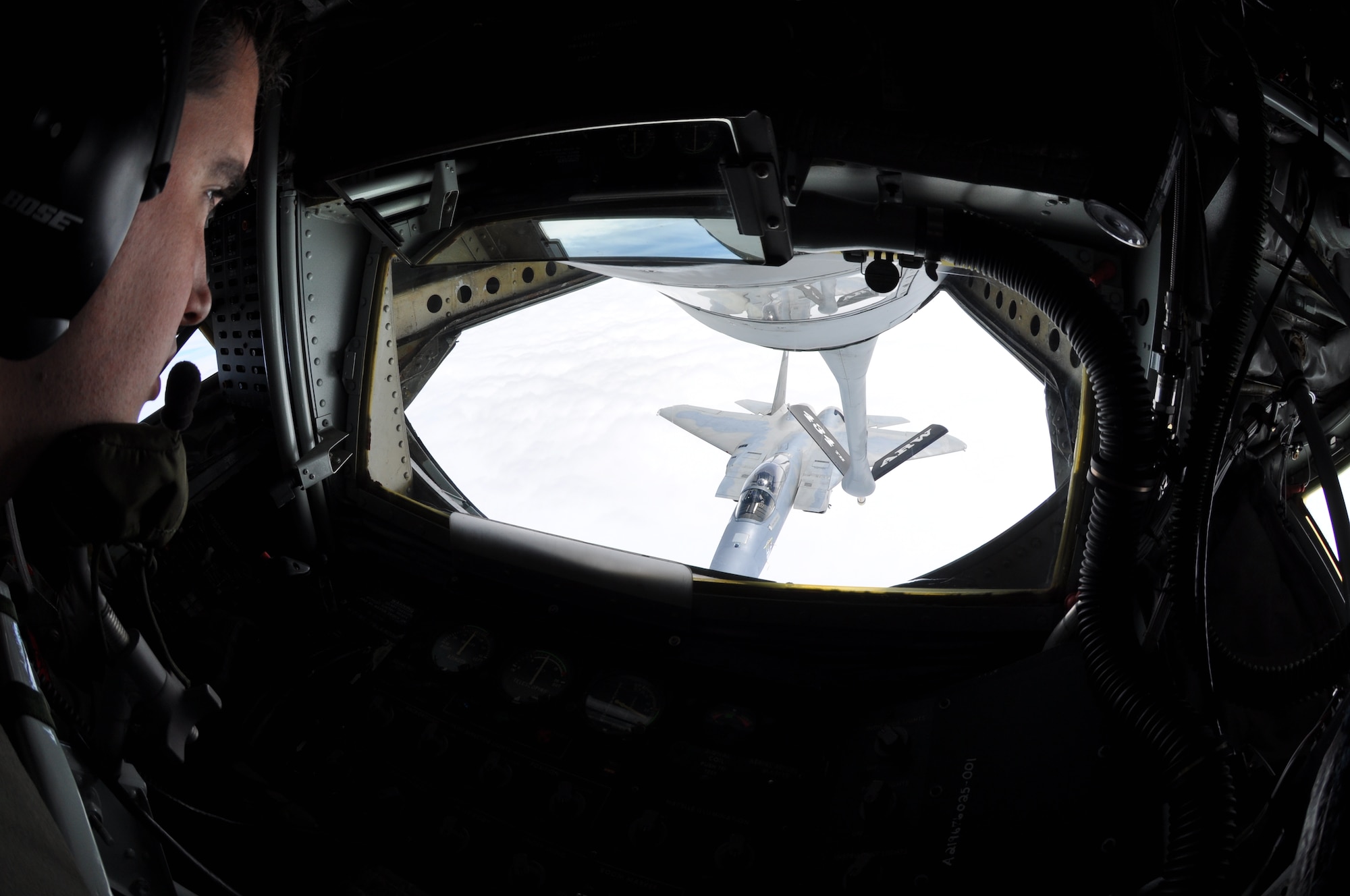 Senior Airman Joshua Fagerburg, 74th Air Refueling Squadron KC-135 boom operator, prepares to fuel an F-15 Eagle from the 33d Fighter Wing, Eglin AFB, Fla., Oct 23. (U.S. Air Force photo/Capt. Carrie Kessler)