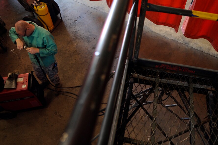BARKSDALE AIR FORCE BASE, La. - Airman 1st Class Joshua Clark a metals technologist from 2d Maintenance Squadron prepares to weld a crack in a B-5 stand at the fabrication flight hanger, Oct. 1. (U.S. Air Force photo by Airman 1st Class Joanna M. Kresge)