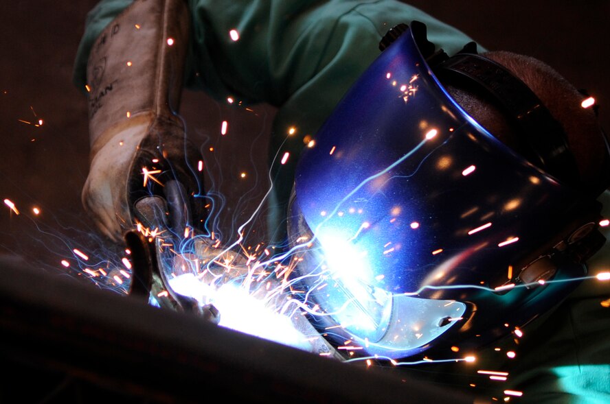 BARKSDALE AIR FORCE BASE, La., - Airman 1st Class Joshua Clark a metals technologist from 2d Maintenance Squadron welds a crack in a B-5 stand in the fabrication flight hanger, Oct. 1. (U.S. Air Force photo by Airman 1st Class Joanna M. Kresge)