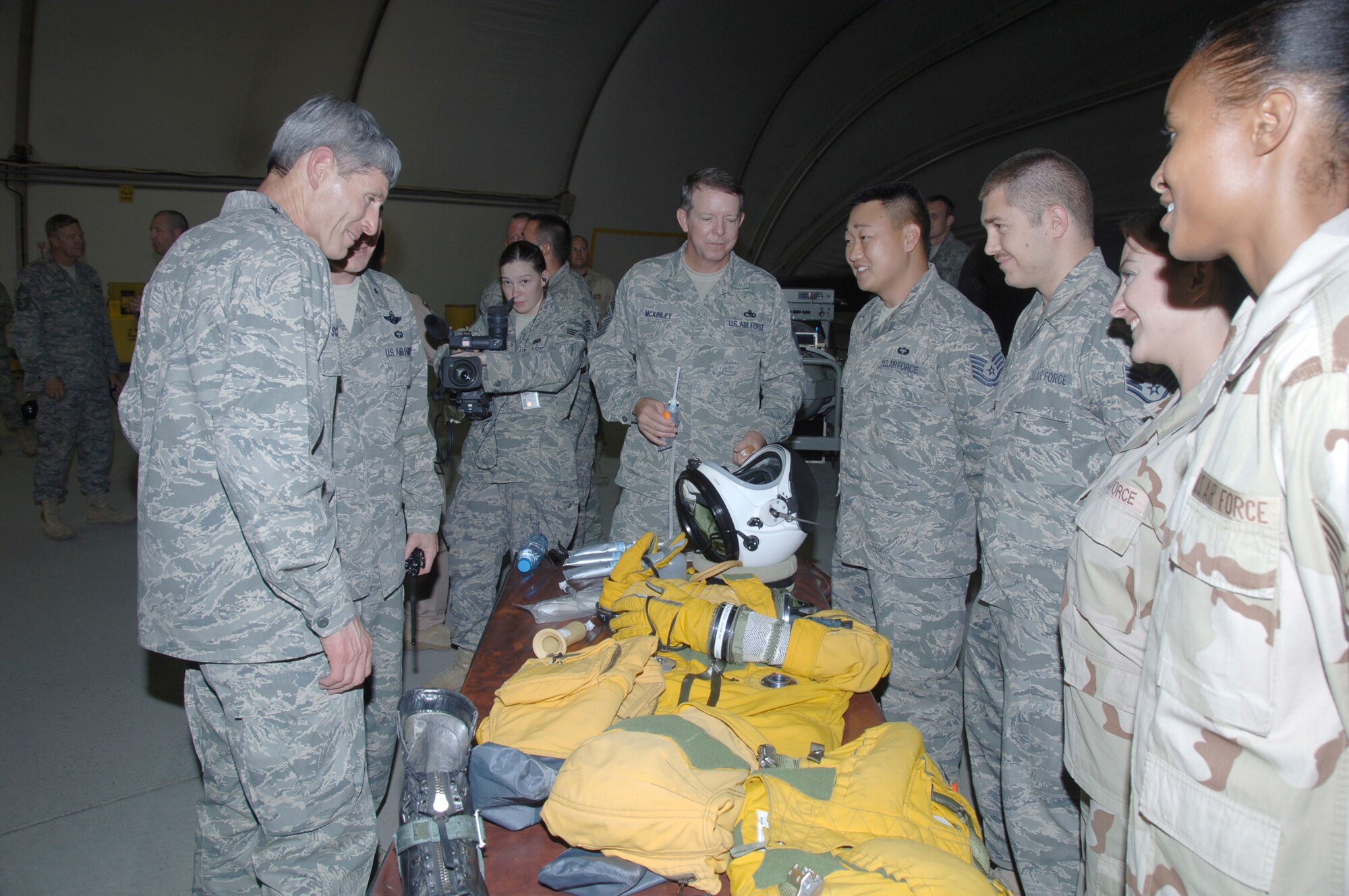 SOUTHWEST ASIA -- Chief of Staff of the Air Force Gen. Norton Schwartz gets a look at one of the flight suits of the 99th Expeditionary Reconnaissance Squadron here Oct. 22. General Schwartz visited the 380th Air Expeditionary Wing to gain a better understanding of the infrastructure and capabilities of one the smaller but most diverse bases in the Area of Responsibility. (U.S. Air Force photo/Tech. Sgt. Christopher A. Campbell)(released)