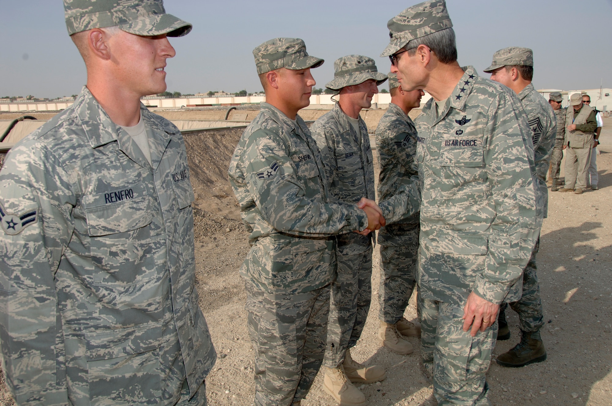 SOUTHWEST ASIA -- Chief of Staff of the Air Force General Norton Schwartz is greeted by Airman 1st Class Mathieu Shepard, a member of the 380th Expeditionary Logistics Readiness Squadron, here Oct. 22. (U.S. Air Force photo by Tech. Sgt. Christopher A. Campbell) (released)