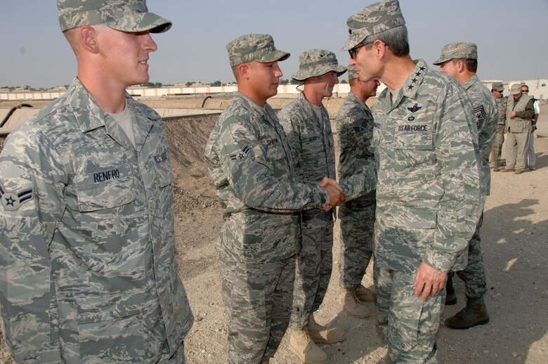 SOUTHWEST ASIA -- Chief of Staff of the Air Force General Norton Schwartz is greeted by Airman 1st Class Mathieu Shepard, a member of the 380th Expeditionary Logistics Readiness Squadron, here Oct. 22. (U.S. Air Force photo by Tech. Sgt. Christopher A. Campbell) (released)
