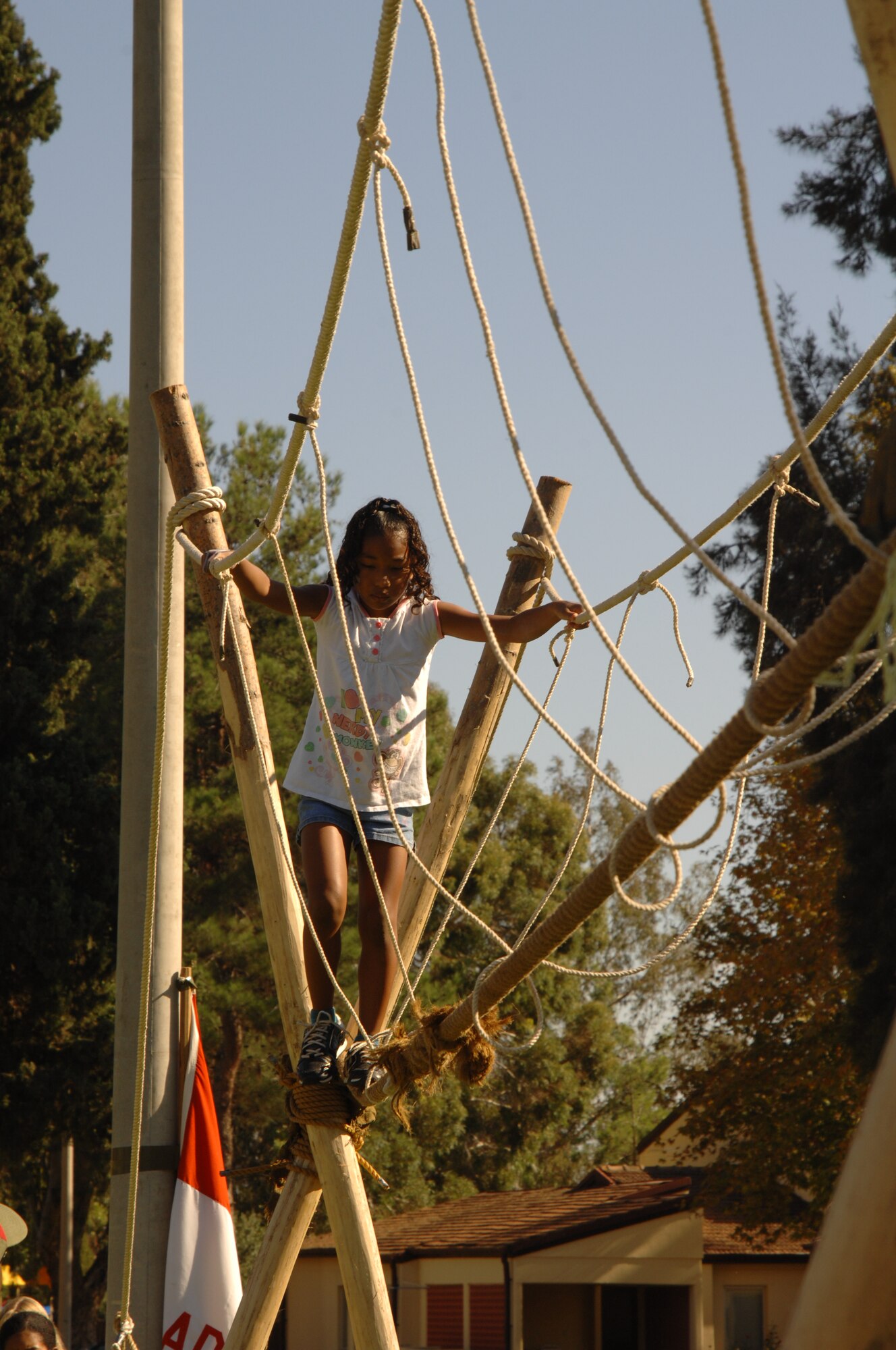 Kayla Haywood walks across the rope bridge set up by Boy Scout Troop 218 during the annual Fall Fest held at Arkadas Park. The bridge was free to use and was built to raise awareness of Incirlik’s Boy Scout Troop.