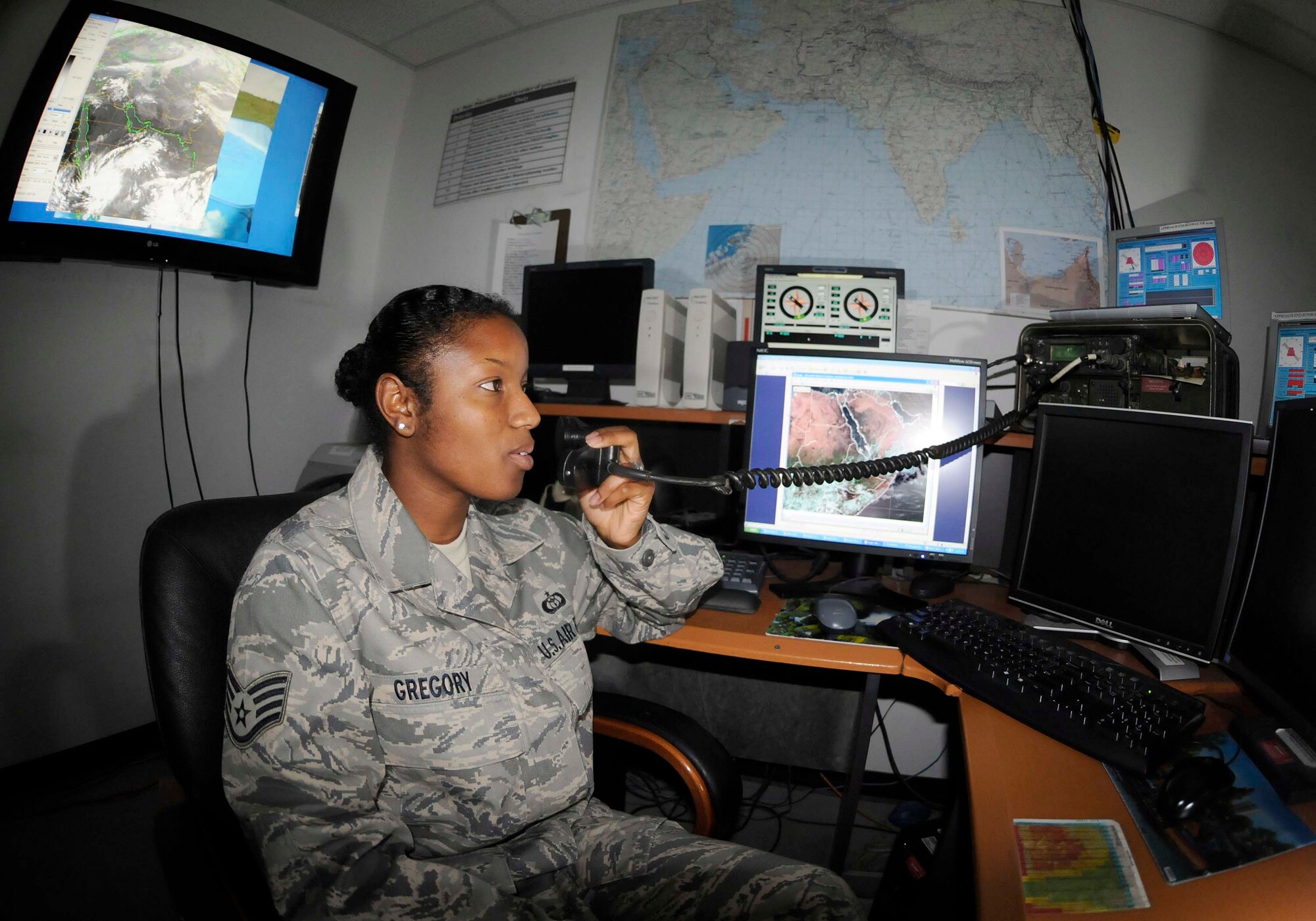 SOUTHWEST ASIA -- Staff Sgt. Stephanie Gregory shares up-to-the-minute weather changes with aircrew and ground personnel. Sergeant Gregory is a weather forecaster deployed to the 380th Expeditionary Operations Support Squadron from MacDill Air Force Base, Fla. She is originally from Kileen, Texas. (Photo by 1st Lt. Michael V. Frye/Released)