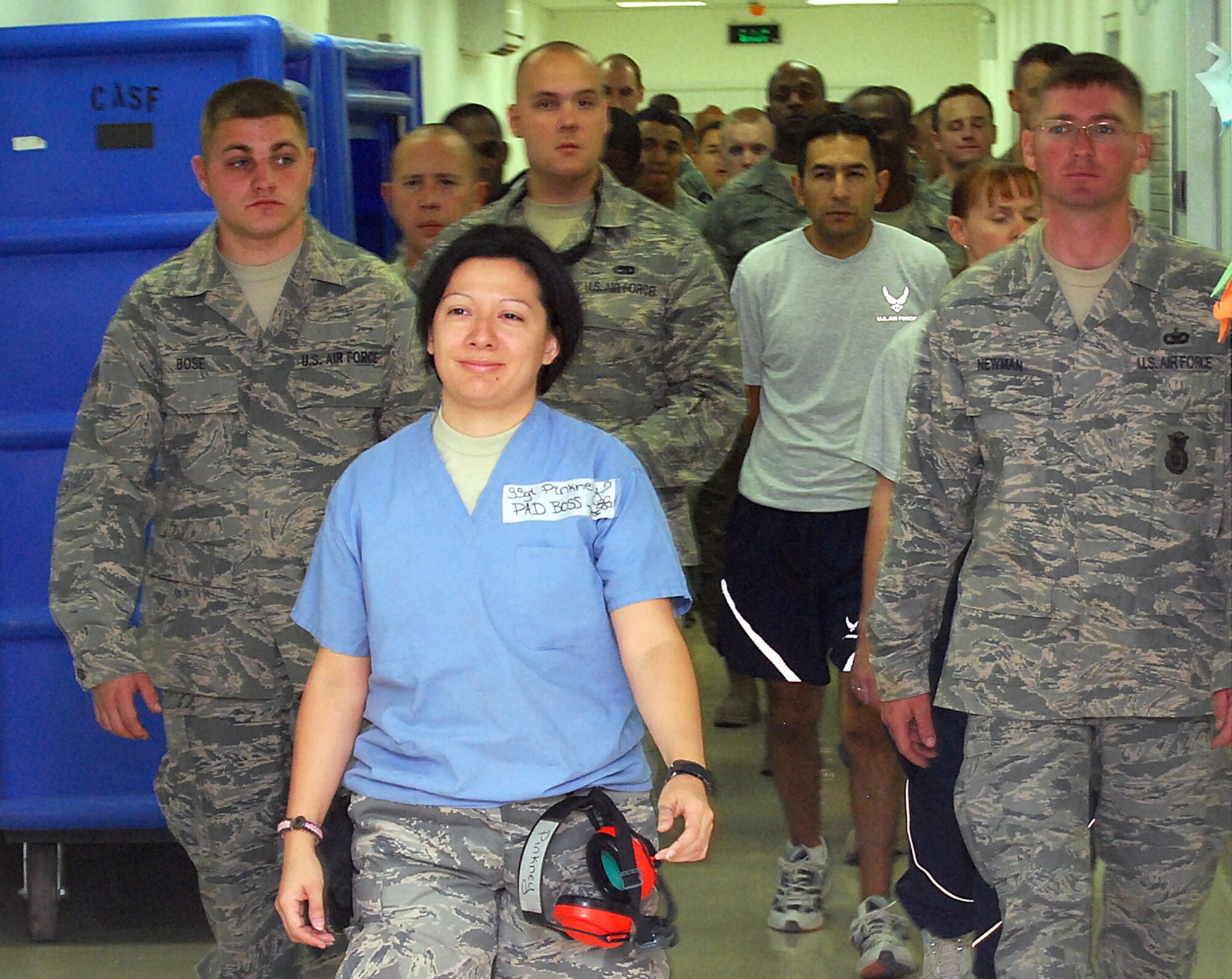 Staff Sgt. Angelica Pinkney takes more than 30 first-time Patient Administration and Disposition volunteers on a tour of the Air Force Theater Hospital at Joint Base Balad, Iraq, Oct. 22. The tour included areas where patients may need to be moved, such as the intensive care unit, intensive care ward and emergency room. Pinkney, the night PAD boss for the 332nd Expeditionary Medical Support Squadron and a native of Freeport, Texas, is deployed from Wilford Hall Medical Center at Lackland Air Force Base, Texas.