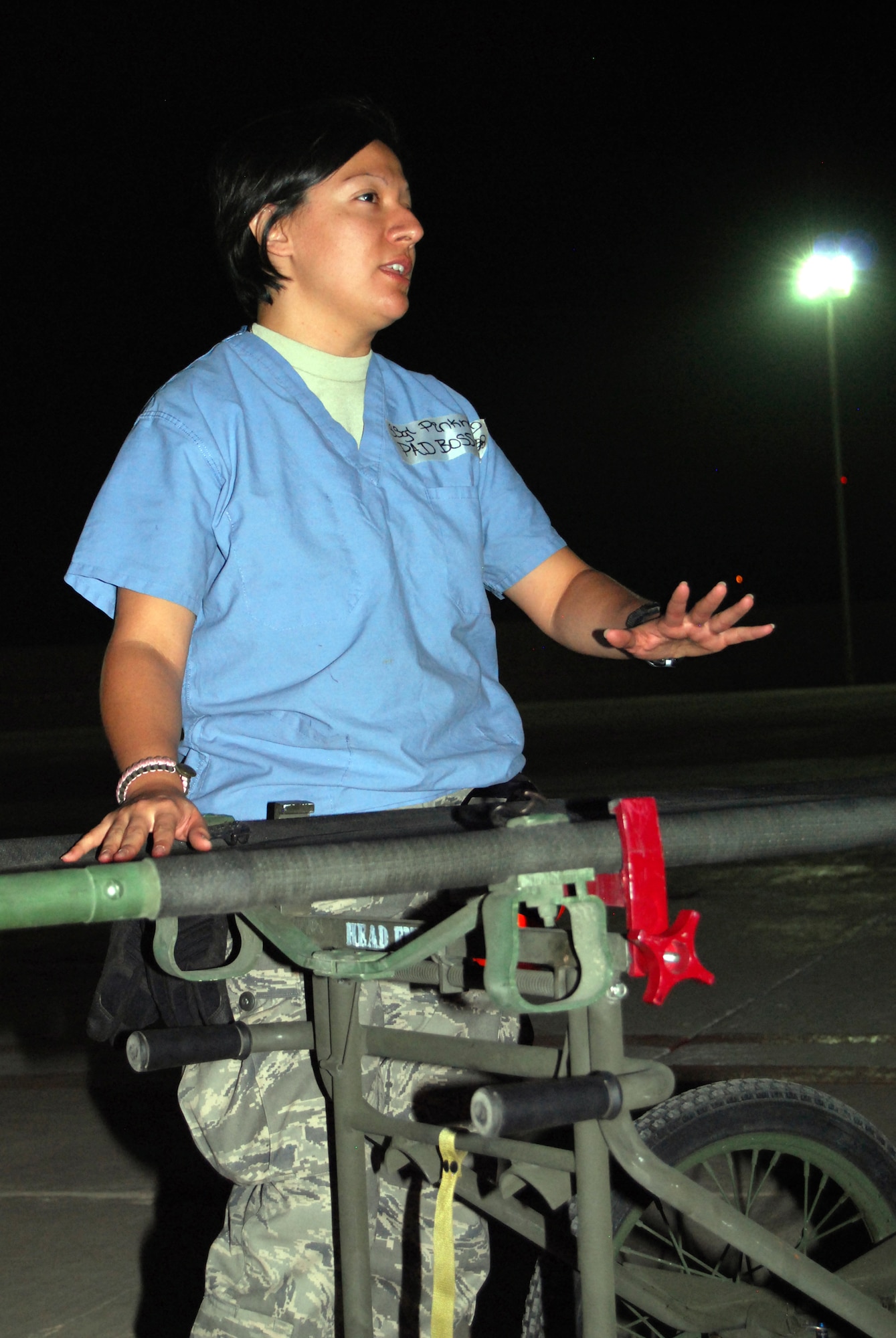 Staff Sgt. Angelica Pinkney explains how to assemble a litter and gurney during Patient Administration and Disposition volunteer training at Joint Base Balad, Iraq, Oct. 22. More than 30 first-time volunteers attended the class, which teaches them to safely transfer patients from UH-60 Blackhawk helicopters into the Air Force Theater Hospital emergency room. Pinkney, the night PAD boss for the 332nd Expeditionary Medical Support Squadron and a native of Freeport, Texas, is deployed from Wilford Hall Medical Center at Lackland Air Force Base, Texas. (U.S. Air Force photo/Staff Sgt. Don Branum)