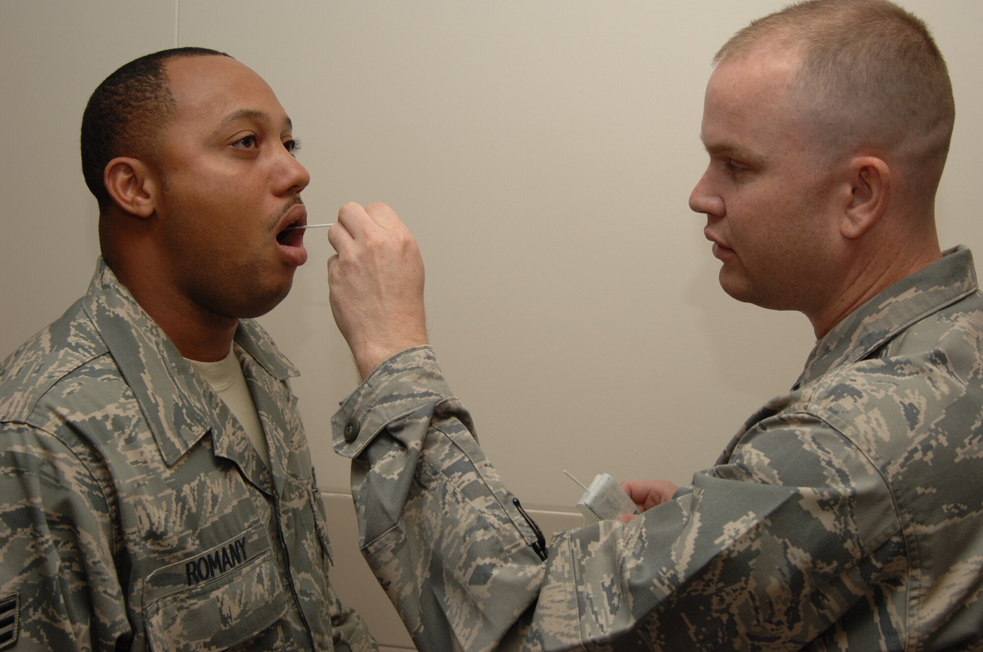 Senior Airman Tarik Romany, 39th Medical Operations Squadron, gets his cheek swabbed by 1Lt. Dustin Price, 39th MDOS, as part of the registration process for potential marrow donors. Incirlik is holding a marrow drive Oct. 27-31.