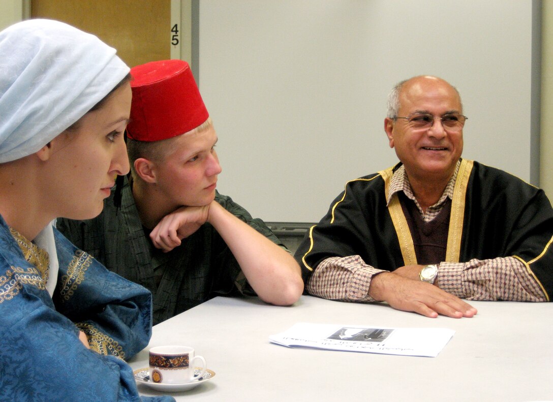 Air Force Airman 1st Class Wendy Walden, left, and Air Force Airman 1st Class Jeremiah Strang, center, listen as their instructor, Ramsis Shenouda, speaks in Arabic on Oct. 22, 2008. The two students, in their third semester of Arabic language study at Defense Language Foreign Language Center in Monterey, Calif., were participating in a three-day immersion activity. DoD photo by Samantha L. Quigley