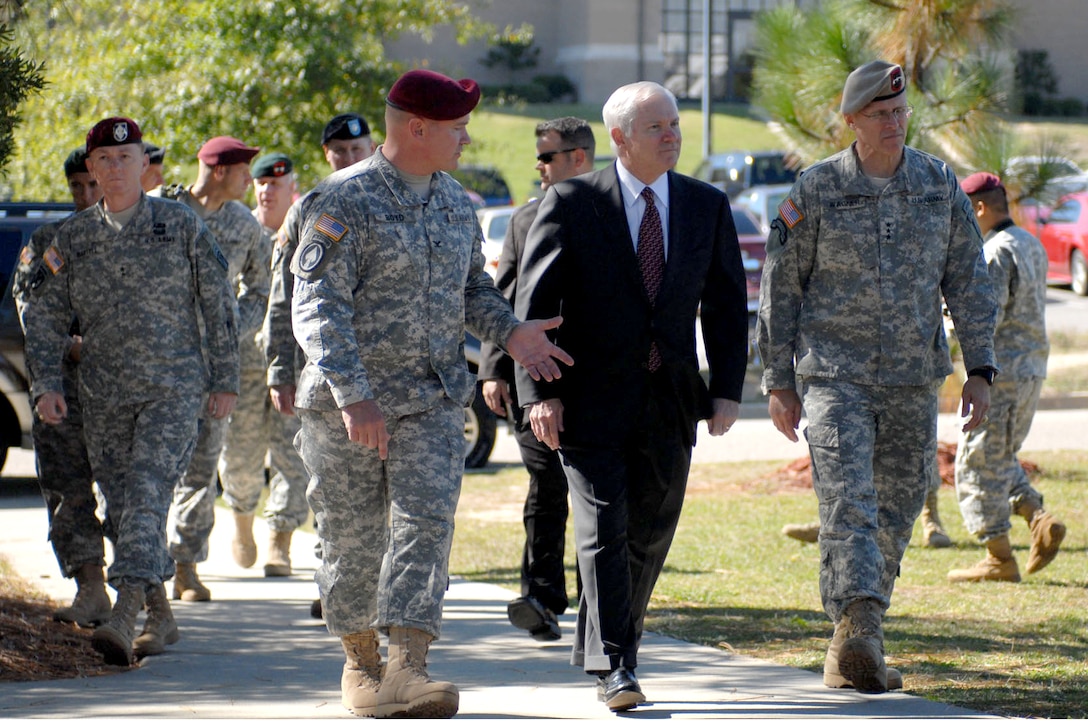 From left, U.S. Army Col. Curtis D. Boyd, commander of 4th Psychological Operations Group (Airborne), accompanies Defense Secretary Robert M. Gates and Lt. Gen. Robert W. Wagner, commanding general of United States Army Special Operations Command, on a tour of the facilities at Fort Bragg Thursday. 