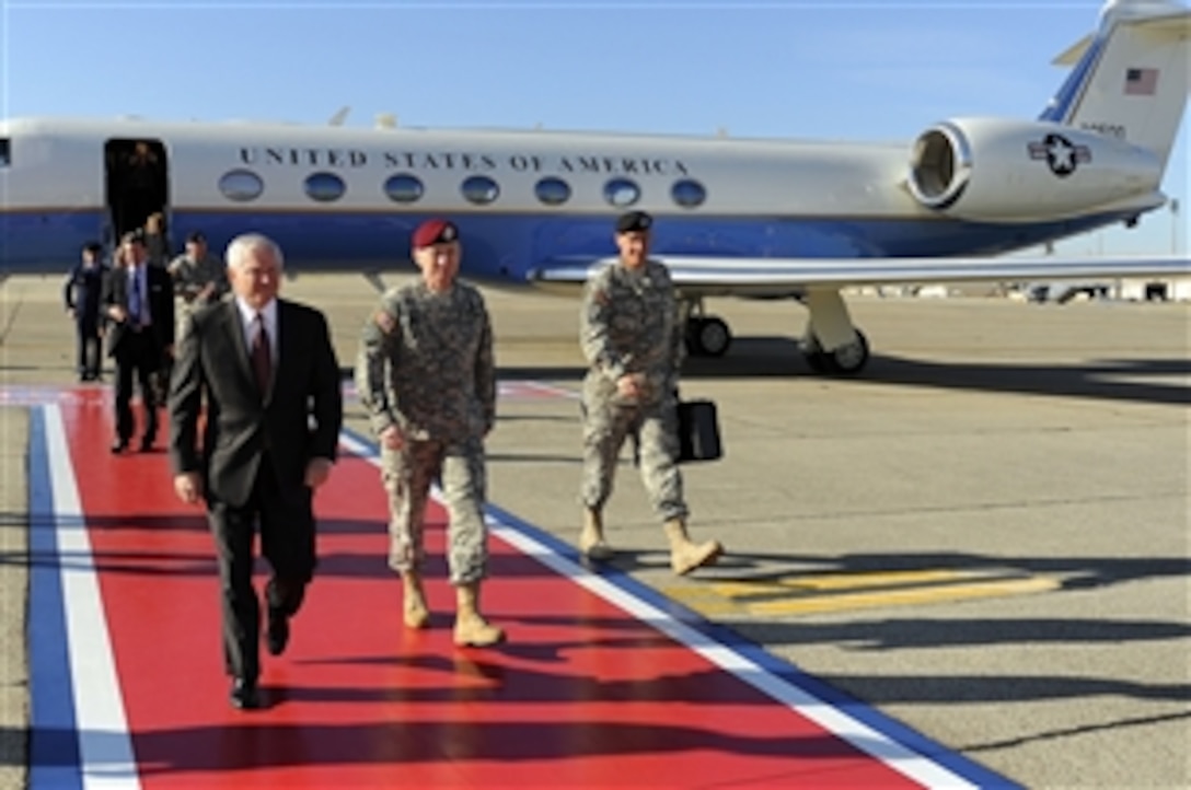 U.S. Defense Secretary Robert M. Gates arrives at Pope Air Force Base, N.C., during a recent trip to Fort Bragg while receiving a special forces capabilities demonstration, Oct. 23, 2008. 