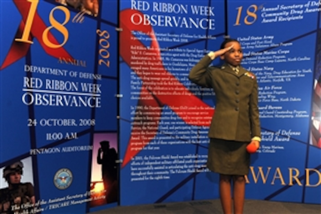 Young Marine Lance Cpl. Jhane Price salutes after giving a speech titiled, "Why I'm Drug Free" during the 18th Annual Secretary of Defense Drug Awareness Award ceremony at the Pentagon, Oct. 24, 2008.