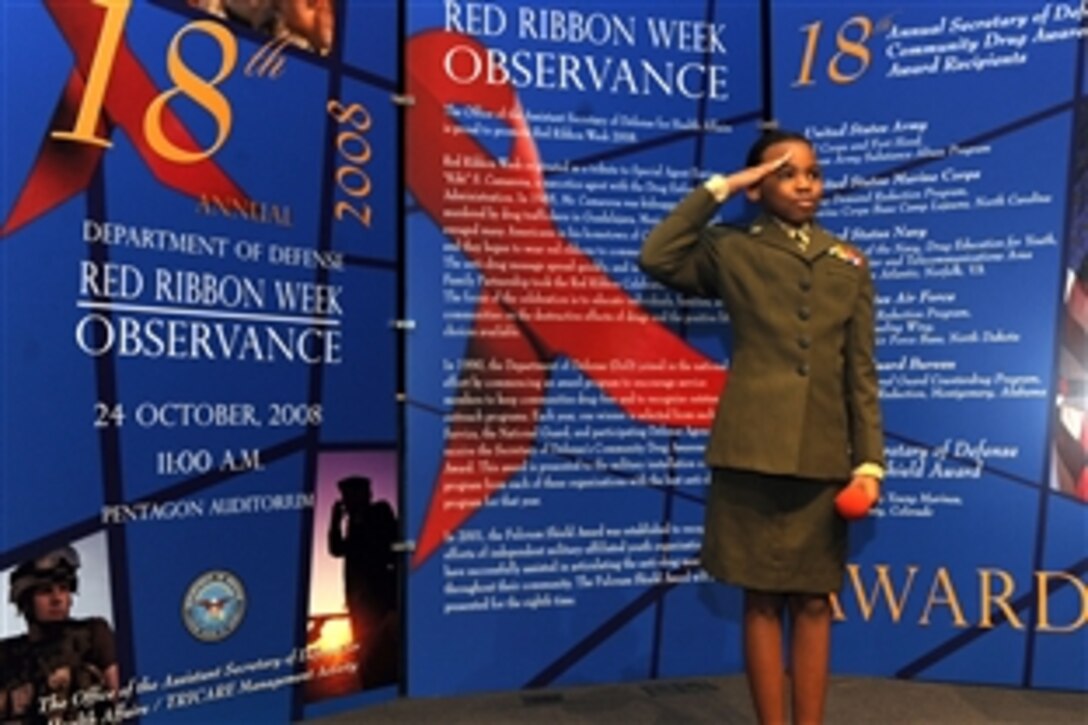 Young Marine Lance Cpl. Jhane Price salutes after giving a speech titiled, "Why I'm Drug Free" during the 18th Annual Secretary of Defense Drug Awareness Award ceremony at the Pentagon, Oct. 24, 2008.