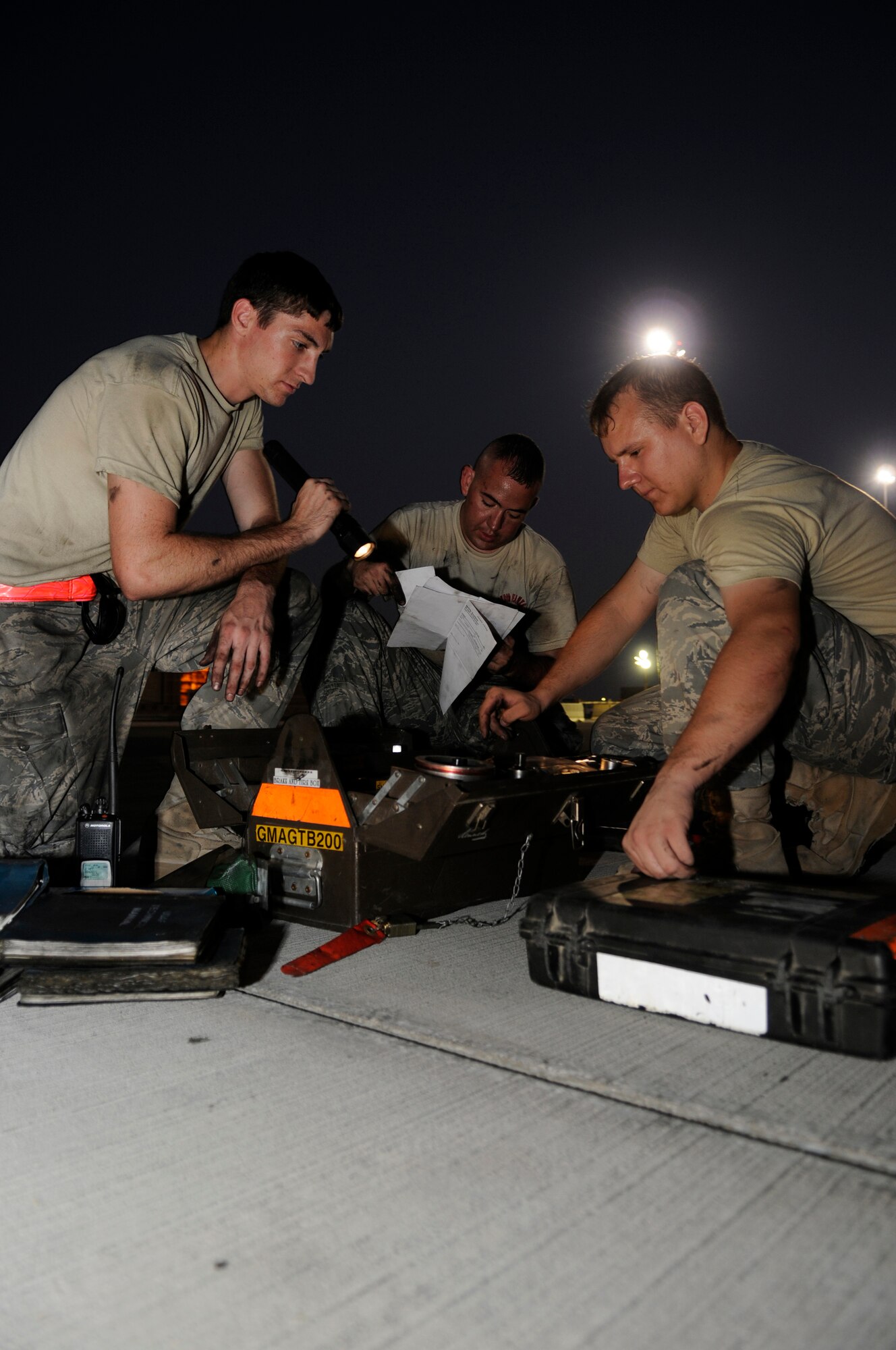 A maintenance team comprised of Airman 1st Class Alexander Lesch, Staff Sgt. Eric Mutschlechner and Staff Sgt. Anthony Hernandez, all assigned to the 379th Aircraft Maintenance Squadron, 340th Aircraft Maintenance Unit, double check, ensuring each piece of equipment is put back into the toolbox where it is supposed to be, October 24, 2008, at an undisclosed air base in Southwest Asia.  The team is cleaning up after completing a brake change on a KC-135 Stratotanker.  The KC-135 provides the core aerial refueling capability for the United States Air Force and provides aerial refueling support to Navy, Marine Corps and allied nation aircraft operating in the Central Command area of responsibility.  Sergeant Mutschlechner, a native of San Marcos, Texas, is deployed from MacDill Air Force Base, Fla.  Sergeant Hernandez hails from Barstow, Calif., and is deployed from McConnell AFB, Kan.  Airman Lesch is from Burlington, Wis., and is deployed from Grand Forks AFB, N.D.  All are deployed in support of Operations Iraqi and Enduring Freedom and Joint Task Force-Horn of Africa.  (U.S. Air Force photo by Tech. Sgt. Michael Boquette/Released)