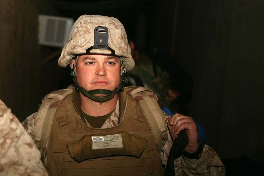 Master Sgt. William 'Spanky' Gibson, force fires chief, Multi National Force - West, waits to get on the aircraft that will begin his trip home.  Gibson, from Pryor, Okla., accepted an invitation as one of the first three staff non-commissioned officers to become Marine Corps Congressional Fellows.