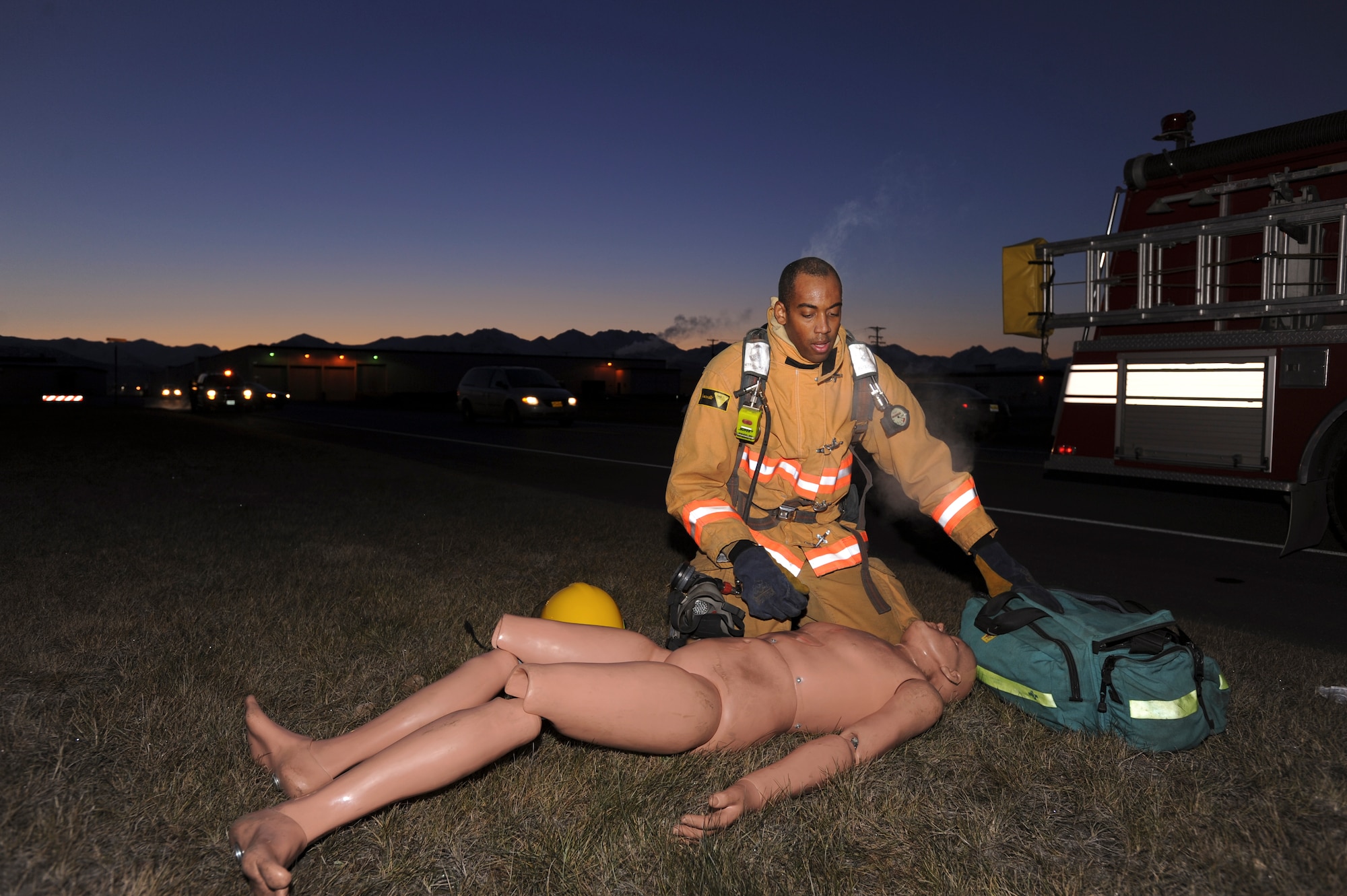 ELMENDORF AIR FORCE BASE Alaska -- Airman 1st Class Michael Whitfield, 3rd Civil Engineer Squadron, administrates self aid buddy care to a "victim" during the Emergency Management Exercise here Oct. 27. The EME tested the Fire fighers capabilities in responding to a crisis and handling possible victims on scene. (U.S. Air Force Photo/Staff Sgt. Joshua Garcia)