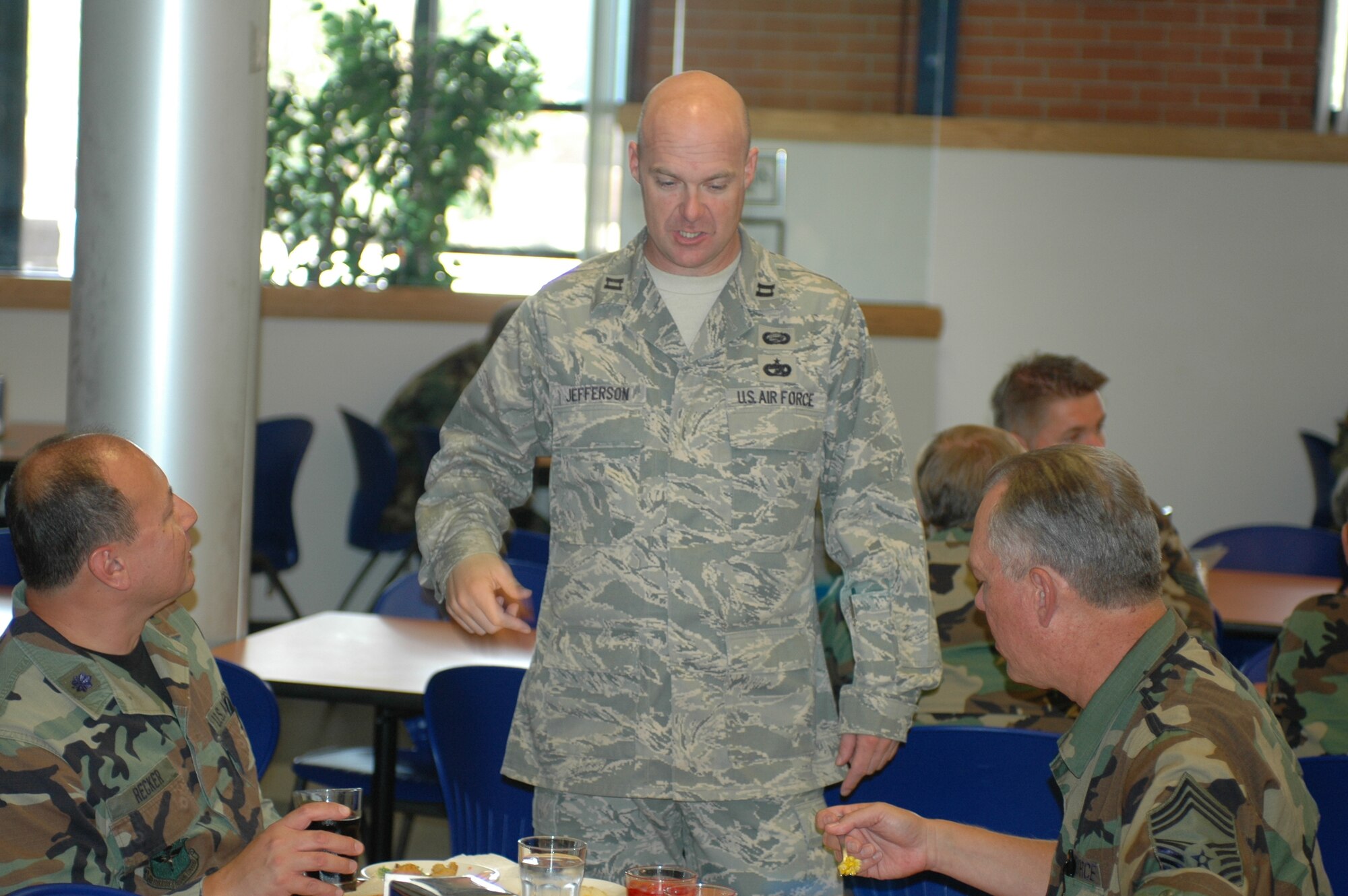 Capt. Paul Jefferson, service’s commander, talks with Chief Master Sgt. Russell Sullivan and Lt. Col. Chuck Recker about their lunch. Captain Jefferson makes sure the food is good, and served with the appropriate portions. Services has to meet Air Force standards within plus or minus 10 percent. That means they are not able to make or lose much money. Monitoring portions is one way they are able to successfully meet rigid standards. (Air National Guard photo by 1st Lt. Dan Dodson)