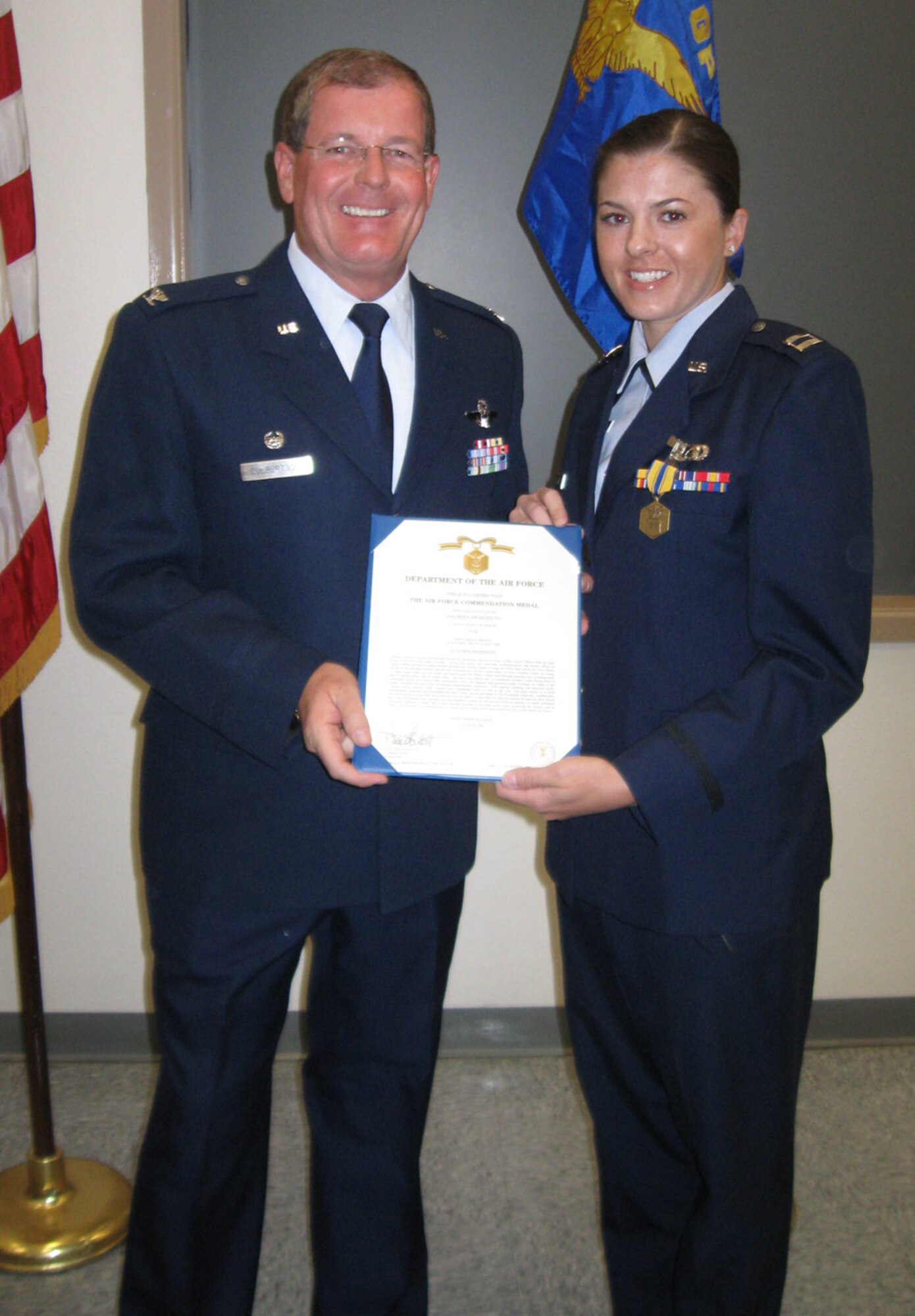 Capt. Jessica Martin, 926th Group Public Affairs Officer, receives a Commendation Medal during Commander's Call on Oct. 25. (U.S. Air Force photo/Maj. Amy Boehle)