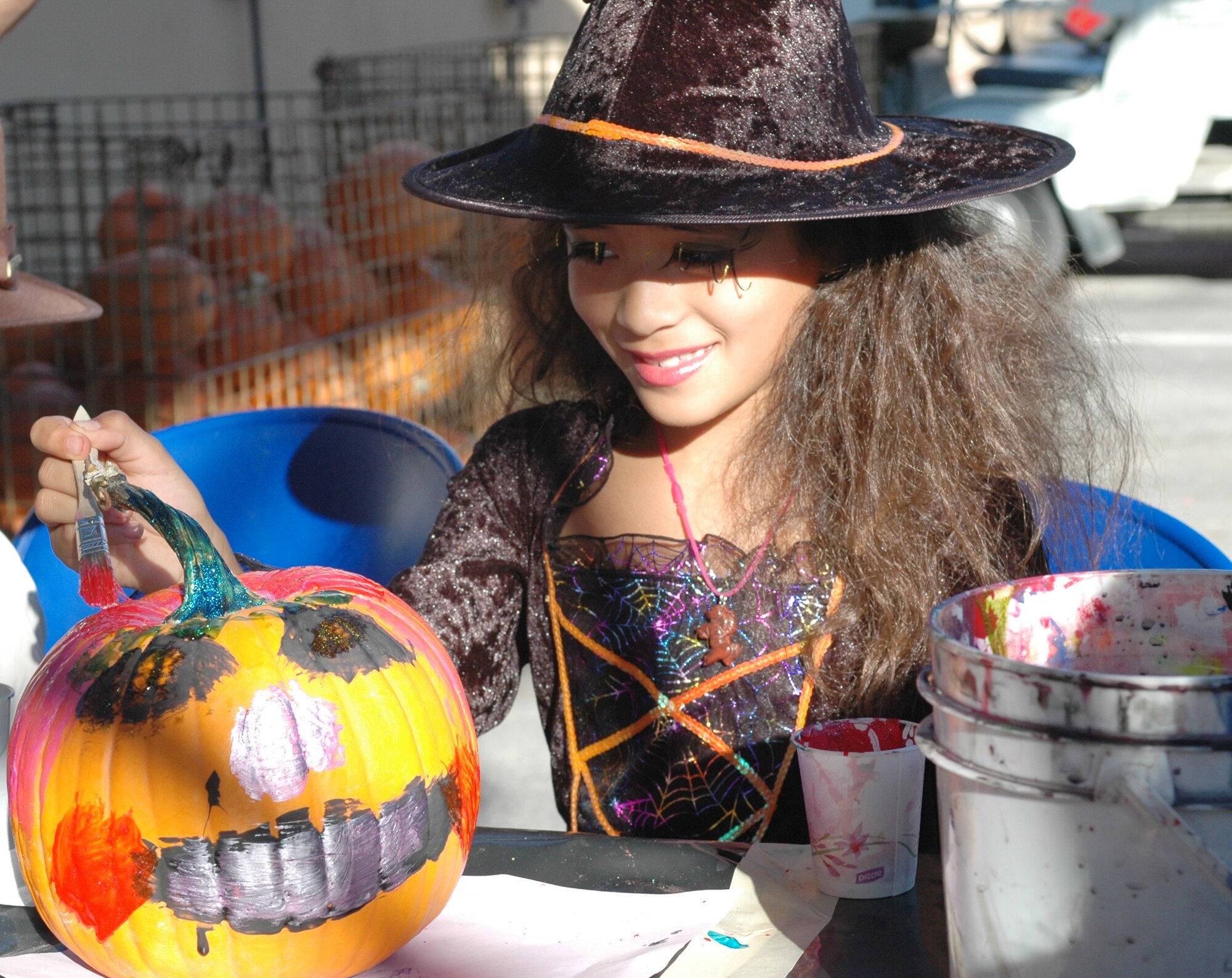 Mikala Highbaugh, 8, niece of Master Sgt. Claudia Austin-Hadley, paints a pumpkin at the 162nd Fighter Wing’s Haunted Hangar event, Oct. 26. Pumpkins were donated from Mrs. Moose’s Pumpkin Patch and Buckelew Farms (Air National Guard photo by Capt. Gabe Johnson)