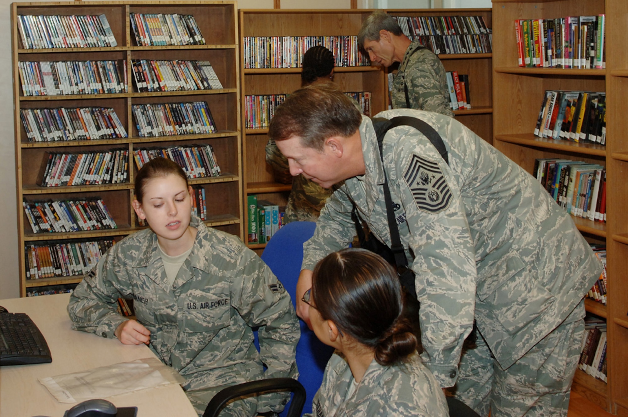 Chief Master Sgt. of the Air Force Rodney McKinley speaks with Airmen at the Housing-6 library on Joint Base Balad, Iraq, Oct. 25. Chief McKinley and Air Force Chief of Staff Gen. Norton Schwartz (background) concluded a week-long tour of the U.S. Central Command area of responsibility and the Horn of Africa with a visit to the 332nd Air Expeditionary Wing. (U.S. Air Force photo/Tech. Sgt. Richard Lisum)