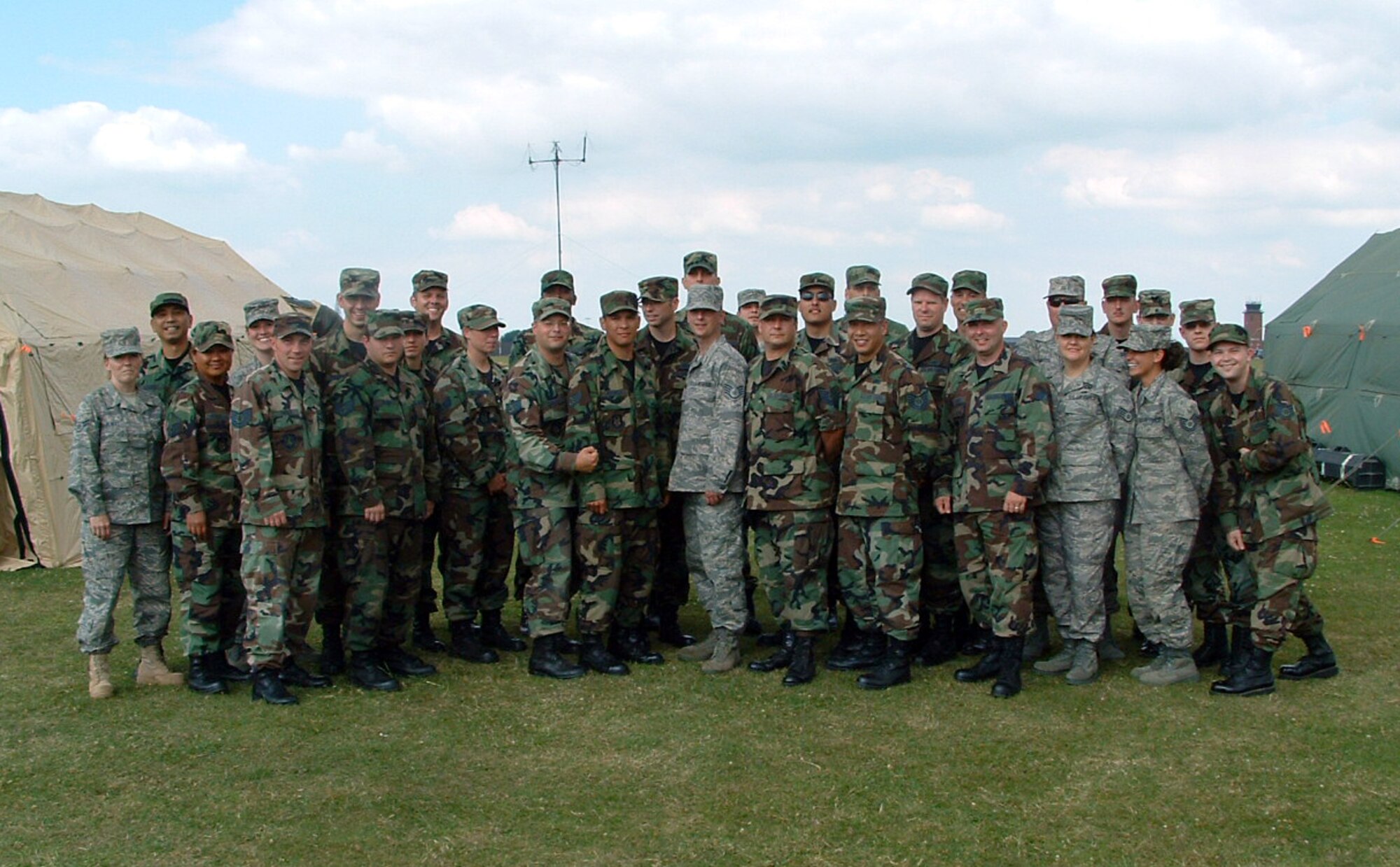 Members from the 919th Communications Squadron gather for a group photo at RAF Mildenhall, England during exercise Royal Endeavor. The exercise, July 11-24, allowed reservists from the 919th CS to train on new equipment, build relationships and test their wartime readiness mission alongside active duty components. (U.S. Air Force Photo\Technical Sergeant Jonathan Eusebio)