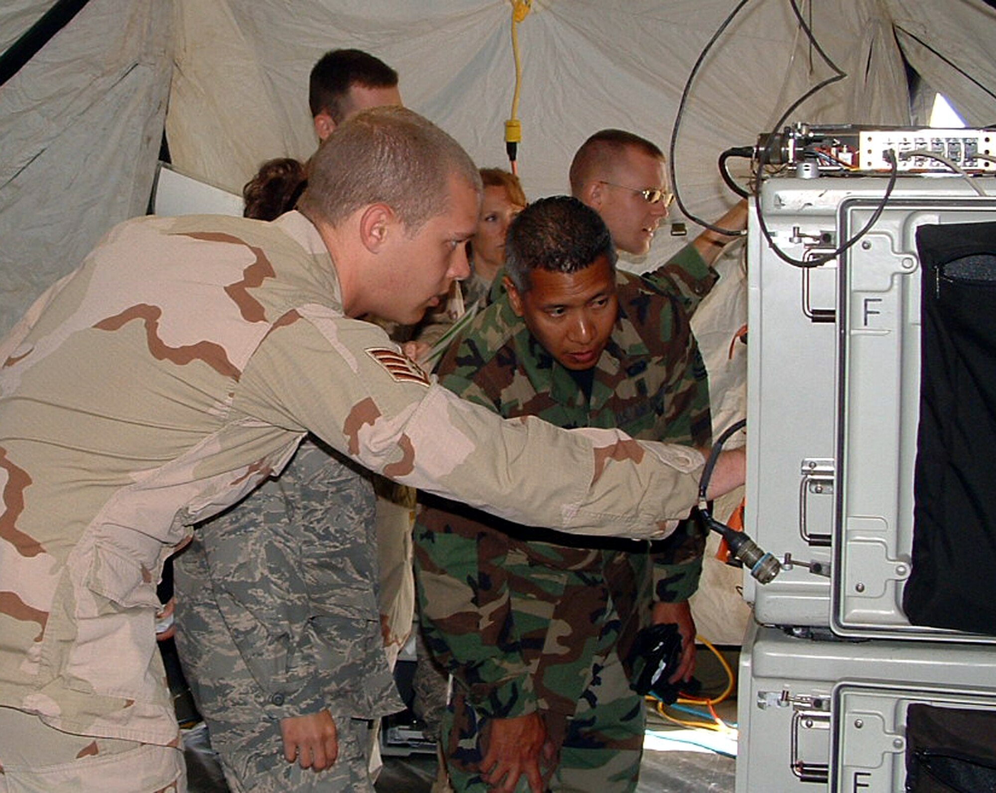 Members from the 919th Communications Squadron train with the 352nd Special Operations Group Communications Flight in RAF Mildenhall, England during exercise Royal Endeavor. The exercise, July 11-24, allowed reservists from the 919th CS to train on new equipment, build relationships and test their wartime readiness mission alongside active duty components. (U.S. Air Force Photo\Technical Sergeant Jonathan Eusebio)