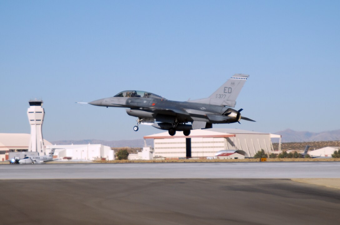 An Edwards F-16 Fighting Falcon lands on a base runway Oct. 23 after the completion of the F-35 Joint Strike Fighter air start testing. The F-16 provided support during the F-35 testing here. (Air Force photo by Senior Airman Julius Delos Reyes)