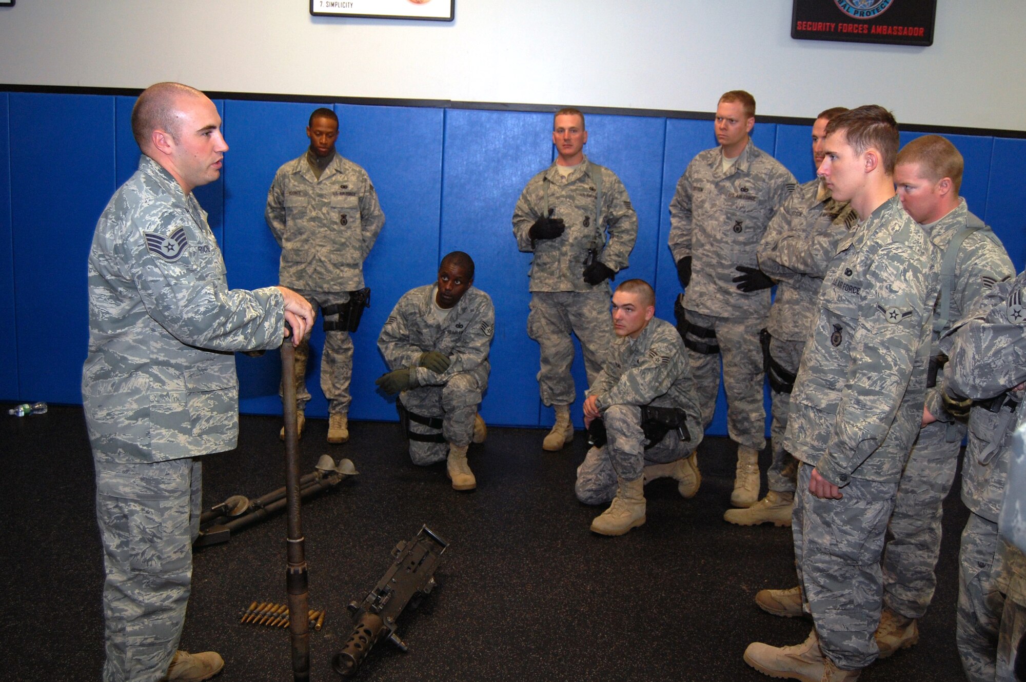 Staff Sgt. Anthony Richards, contingency skills instructor from the 421st Combat Training Squadron, talks to security forces Airmen at the U.S. Air Force Expeditionary Center for training on how to take apart and put back together a .50 caliber machine gun during training in the center on Fort Dix, N.J., Oct. 23, 2008.  The Airmen were training for upcoming deployments to the Southwest Asia deployment theater of operations.  (U.S. Air Force Photo/Tech. Sgt. Scott T. Sturkol)