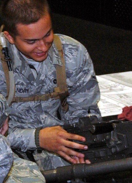 A security forces Airman at the U.S. Air Force Expeditionary Center for training learns how to take apart and put back together a .50 caliber machine gun during training in the center on Fort Dix, N.J., Oct. 23, 2008.  The Airmen were training for upcoming deployments to the Southwest Asia deployment theater of operations.  (U.S. Air Force Photo/Tech. Sgt. Scott T. Sturkol)