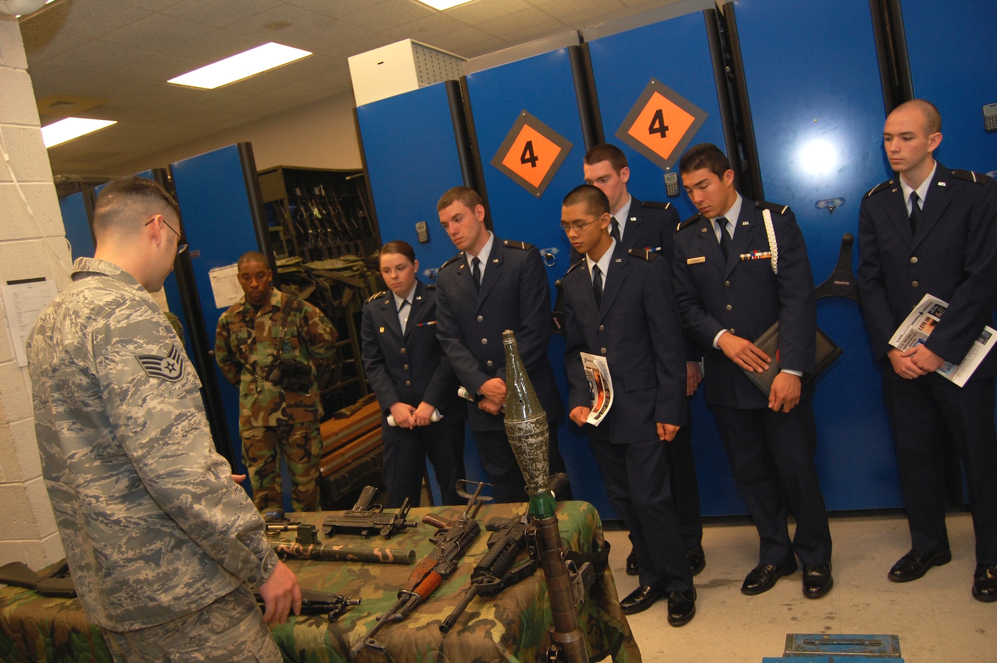 Staff Sgt. Ryan Marcotte, combat arms instructor, shows cadets from Air Force ROTC Detachment 485 of Rutgers University weapons used by students in the U.S. Air Force Expeditionary Center armory Oct. 23, 2008, on Fort Dix, N.J..  The cadets came to the center as part of an opportunity to learn about the center's mission and training. The tour was hosted by the USAF EC Public Affairs Office.  (U.S. Air Force Photo/Tech. Sgt. Scott T. Sturkol)