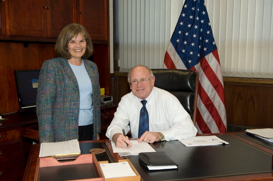 Rich Lombardi, who came aboard as the Electronic Systems Center executive director Oct. 27, shares a smile with his executive officer, Patricia Springer, during his first official day on the job.  Mr. Lombardi, a member of the Senior Executive Service, had most recently served as the Air Force’s Budget Investment director.