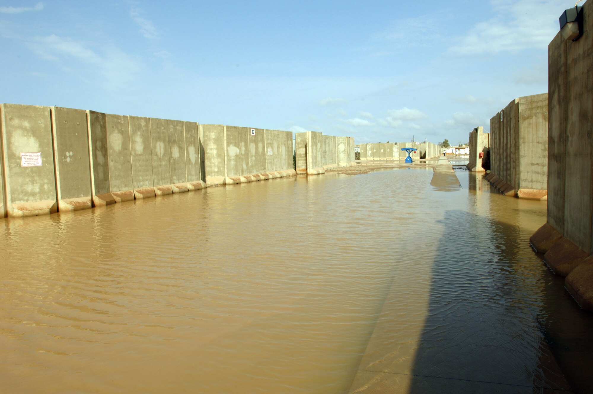Water floods a housing area Oct. 25 at Joint Base Balad, Iraq. Because rain is infrequent in Iraq, when it does rain, the hardened ground soaks up little water. (U.S. Air Force photo/Tech. Sgt. Erik Gudmundson) 
