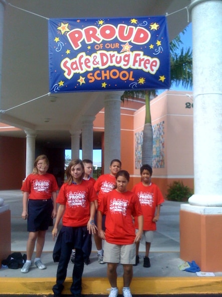 Kids from Keys Gate Charter School, Homestead, Fla., participate in Red Ribbon Week 2008. Members of the Homestead ARB Demand Reduction Program Office partnered with the school to participate in the week's activities.  The DRP office donated drug awareness and prevention information to include: red ribbons, stress balls & cones, cups, and calculators. (Photo courtesy of Keys Gate Charter School) 
