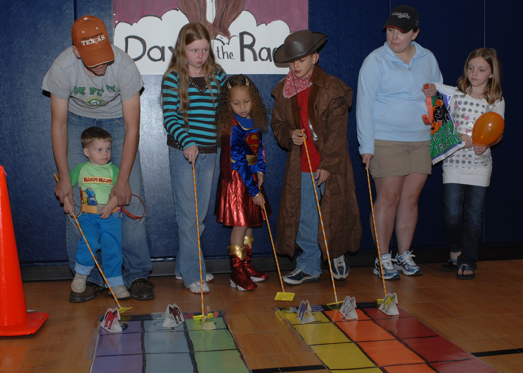 DYESS AIR FORCE BASE, Texas -- A group of parents and children participate in activities at the Youth Center Fall Festival here, Oct. 24. More than 240 Dyess families participated in the event.   (U.S. Air Force photo/ Senior Airman Jennifer Romig)
