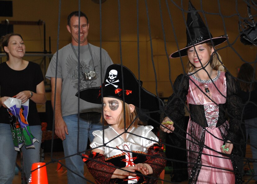 DYESS AIR FORCE BASE, Texas -- Kara and Kylie Kirkland, daughters of Staff Sgt. Chad Kirkland, participate in the youth centers Fall Festival here, Oct. 24.  (U.S. Air Force photo/Senior Airman Jennifer Romig)