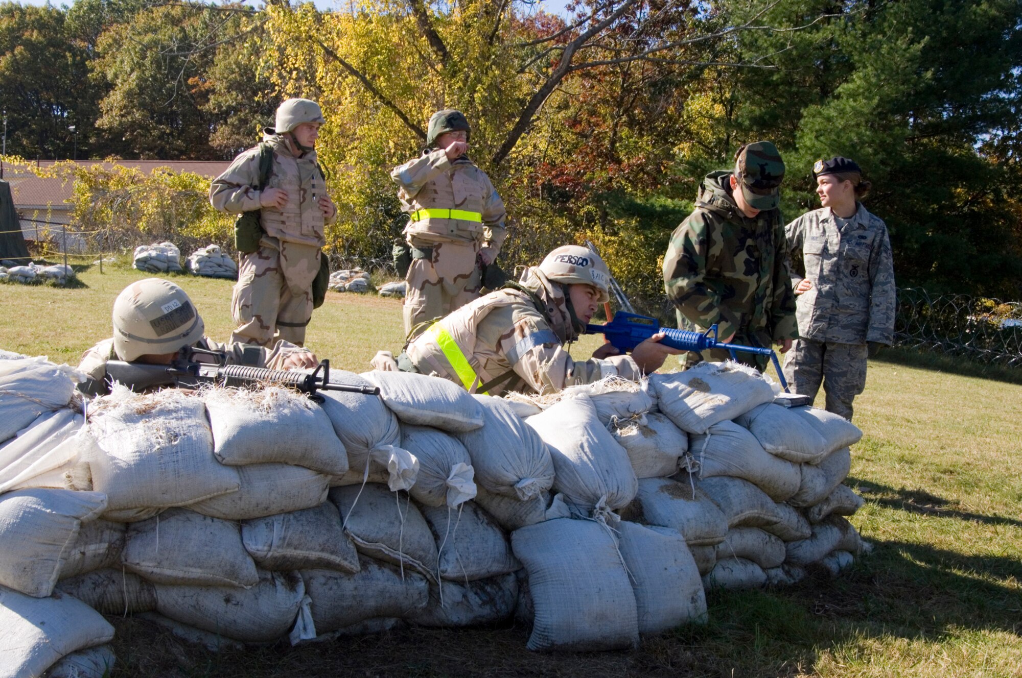 HANSCOM AIR FORCE BASE, Mass. – Hanscom Airmen receive combat skills training from 66th Security Forces Squadron personnel at Camp Patriot on Oct. 23, during a Base Readiness Exercise. More than 230 Airmen participated in readiness training focusing on combat skills, Air Force Manual training, weapons familiarization, CBRNE training and Post Attack Reconnaissance techniques. The exercise was part of the base’s preparations for the Nov. 1-10 Unit Compliance Inspection and Targeted Readiness Inspection. (U.S. Air Force photo by Rick Berry)