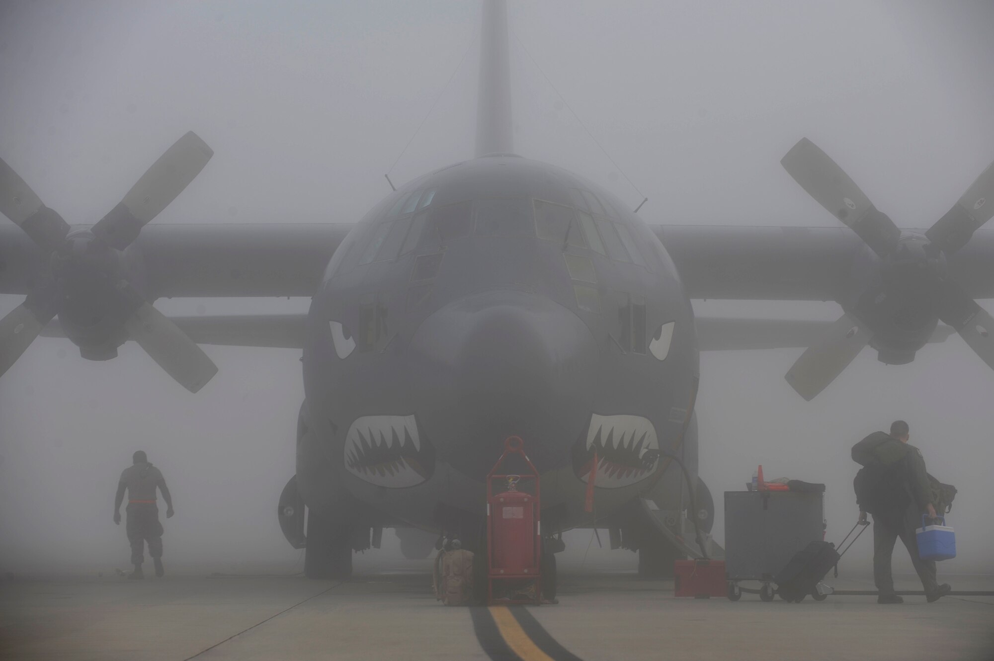 MOODY AIR FORCE BASE, Ga. – Airmen perform maintenance on an HC-130P Hercules aircraft during inclement weather Oct. 16 here. Despite thick fog, 71st Rescue Squadron and 723rd Aircraft Maintenance Squadron Airmen carried on their tasks as usual. (U.S. Air Force photo by Senior Airman Brittany Barker)