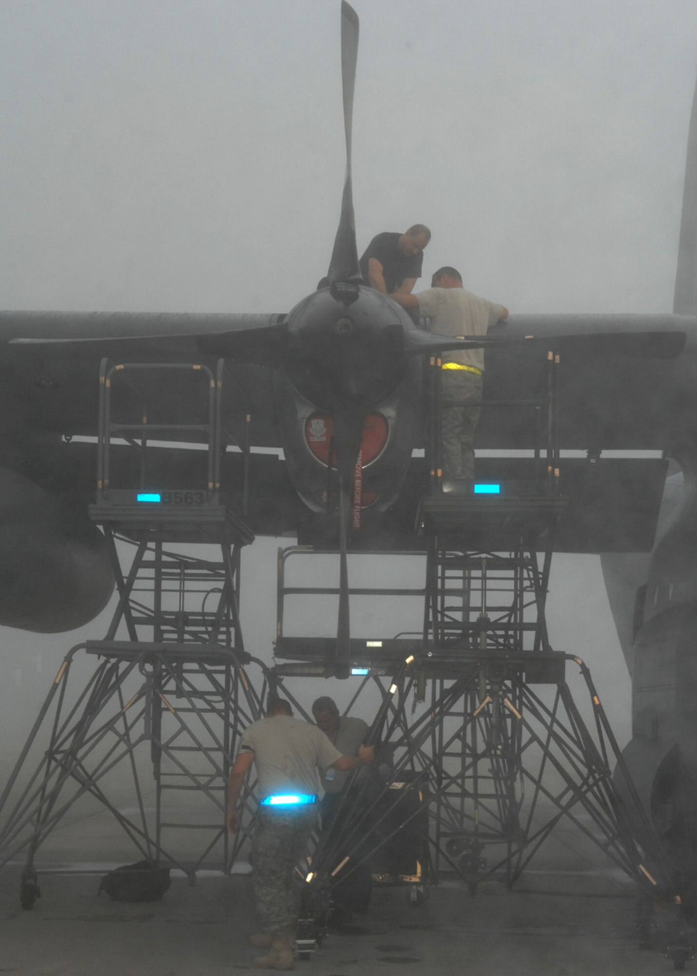 MOODY AIR FORCE BASE, Ga. – Maintainers from the 723rd Aircraft Maintenance Squadron perform repairs on a HC-130P Hercules Oct. 16 here. Maintainers perform their duties during all aspects of weather, including thick fog. (U.S. Air Force photo by Airman Joshua Green)