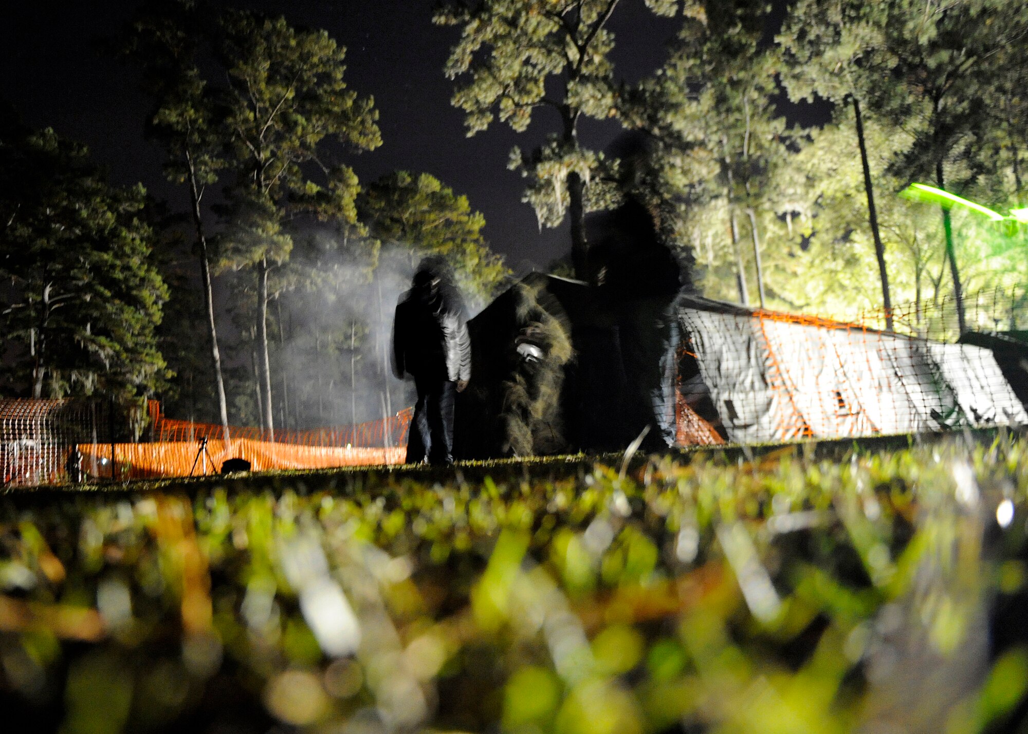 MOODY AIR FORCE BASE, Ga. – Volunteers dressed in Halloween costumes run out of the 23rd Civil Engineer Squadron Haunted House Oct. 25 here. The haunted house features multiple rooms with scary characters. (U.S. Air Force photo by Senior Airman Brittany Barker) 