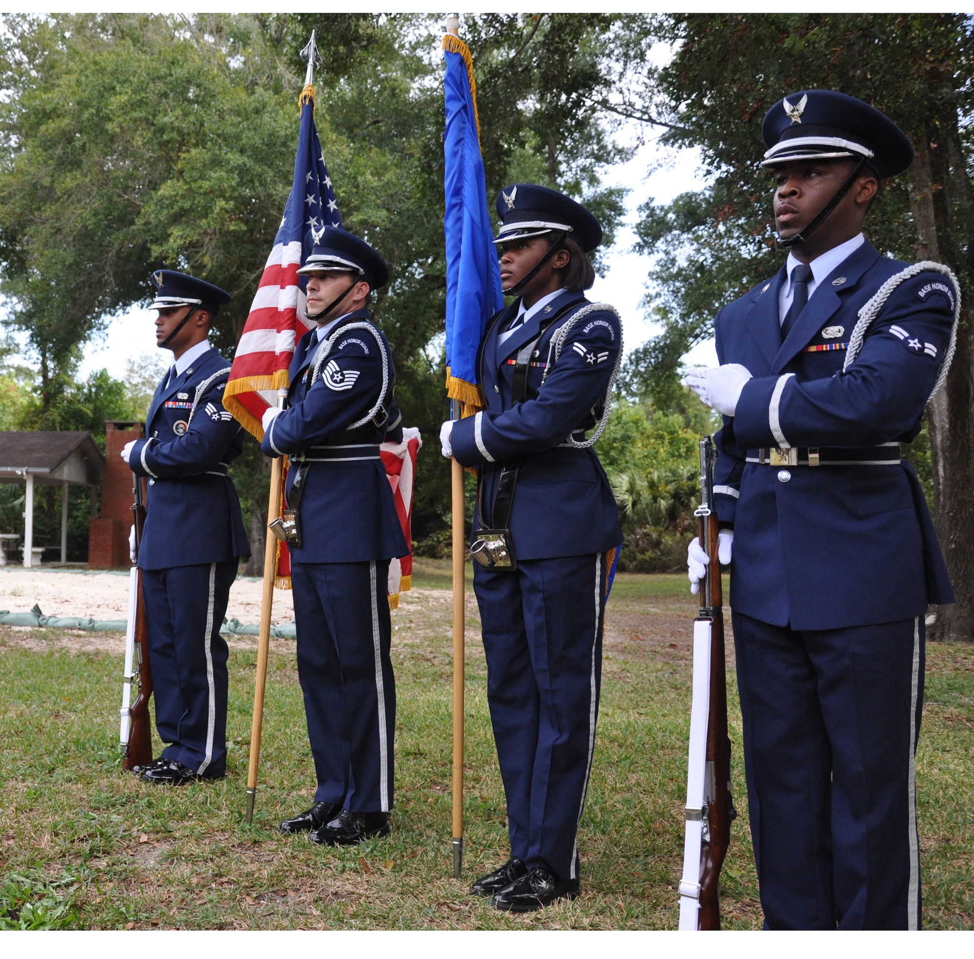 EGLIN AIR FORCE BASE, Fla. -- Airman 1st Class Bobby Lacy, left, Tech. Sgt. Chris Lajoie, Airman 1st Class Brittany Polk and Senior Airman Maurice Ward practice presenting the colors at the Eglin Honor Guard training compound. The Eglin Honor Guard performs ceremonies such as funerals, weddings and other official ceremonies. (U.S. Air Force photo by Airman 1st Class Anthony Jennings)