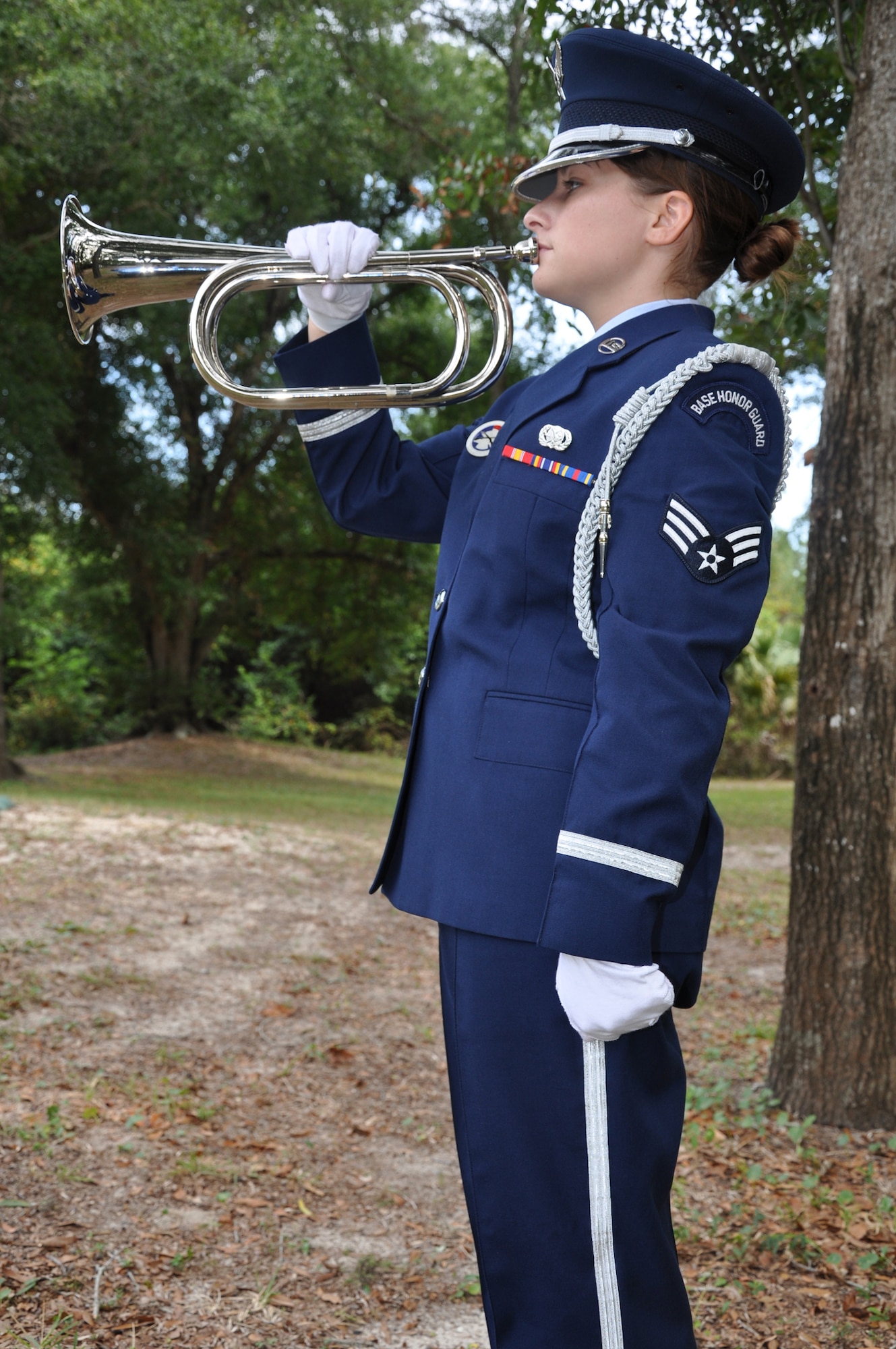 EGLIN AIR FORCE BASE, Fla. -- Senior Airman Jaclyn Laws, an Eglin Honor Guard member from the 96th Logistics Readiness Squadron, plays "Taps" during ceremoy practice. (U.S. Air Force photo by Airman 1st Class Anthony Jennings)